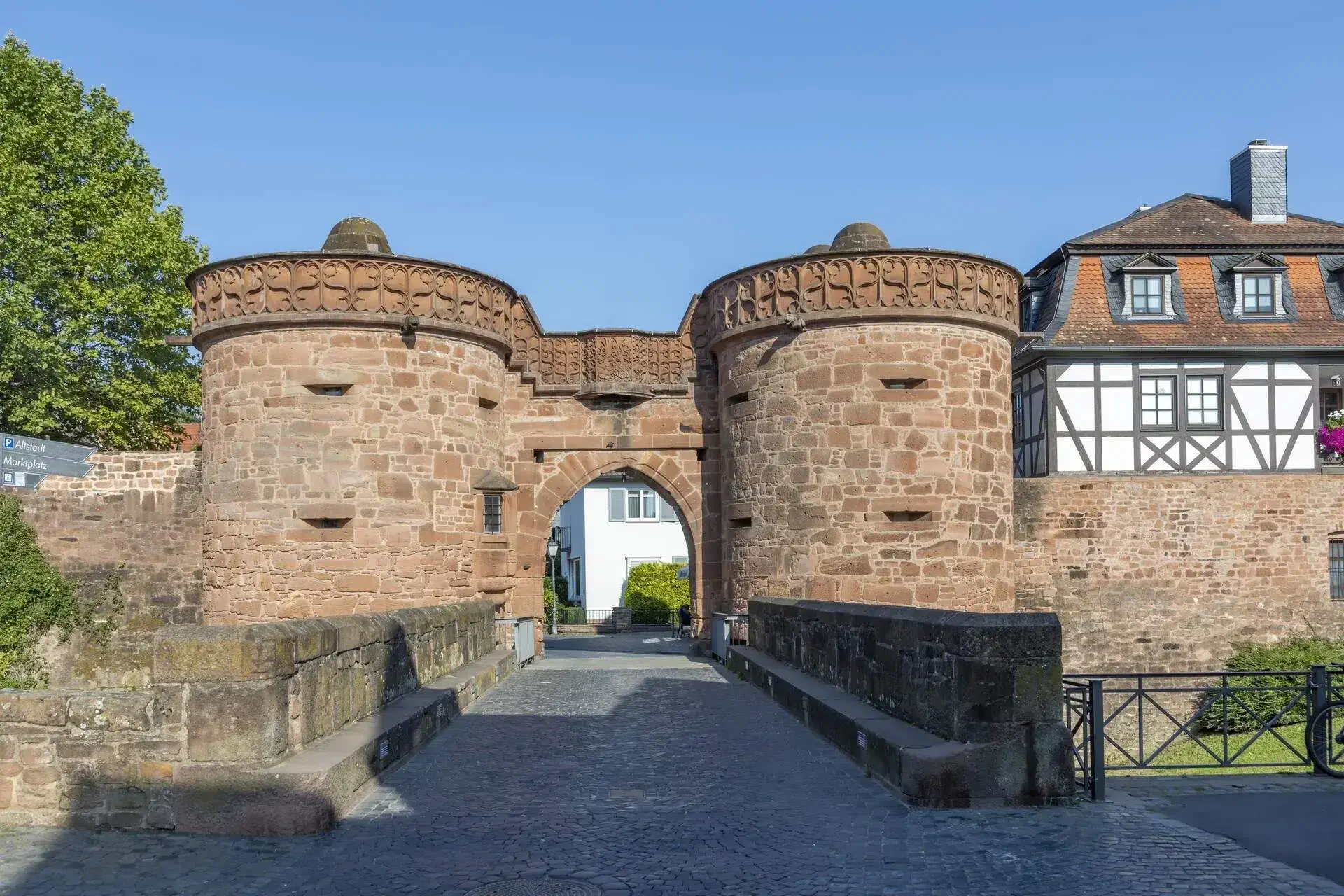 scenic view of the Jerusalem town gate and the historic town wall with half timbered houses in Budingen, Germany