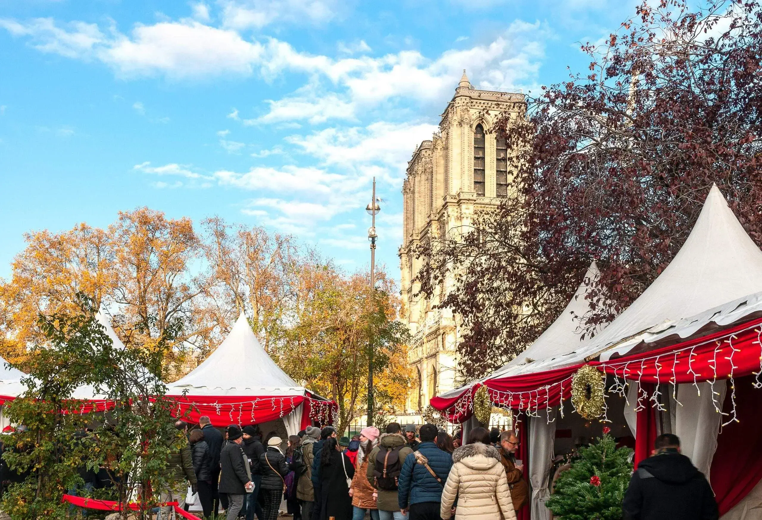 Christmas market near Notre Dame, with the cathedral in background. Paris in France.