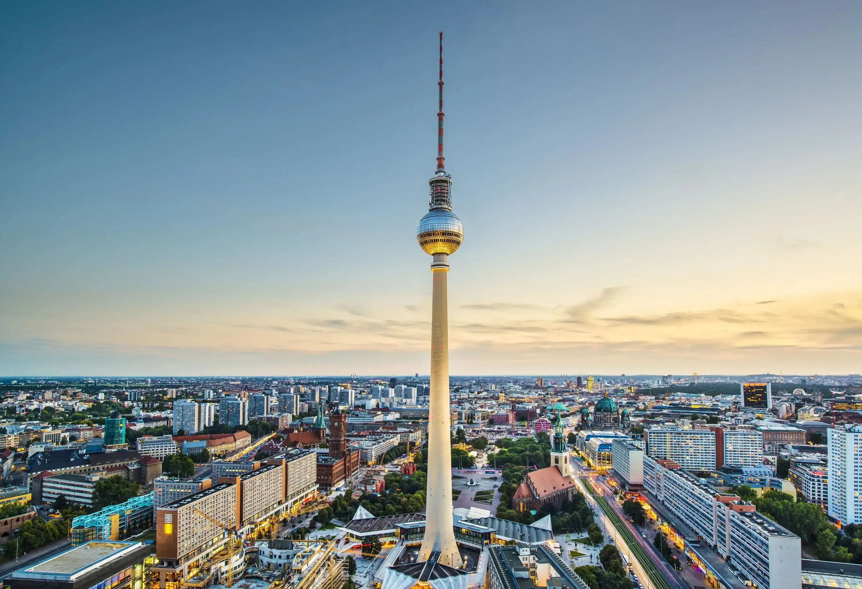 Berlin Television Tower features a spherical body and a tall antenna that is situated in the middle of a metropolis.