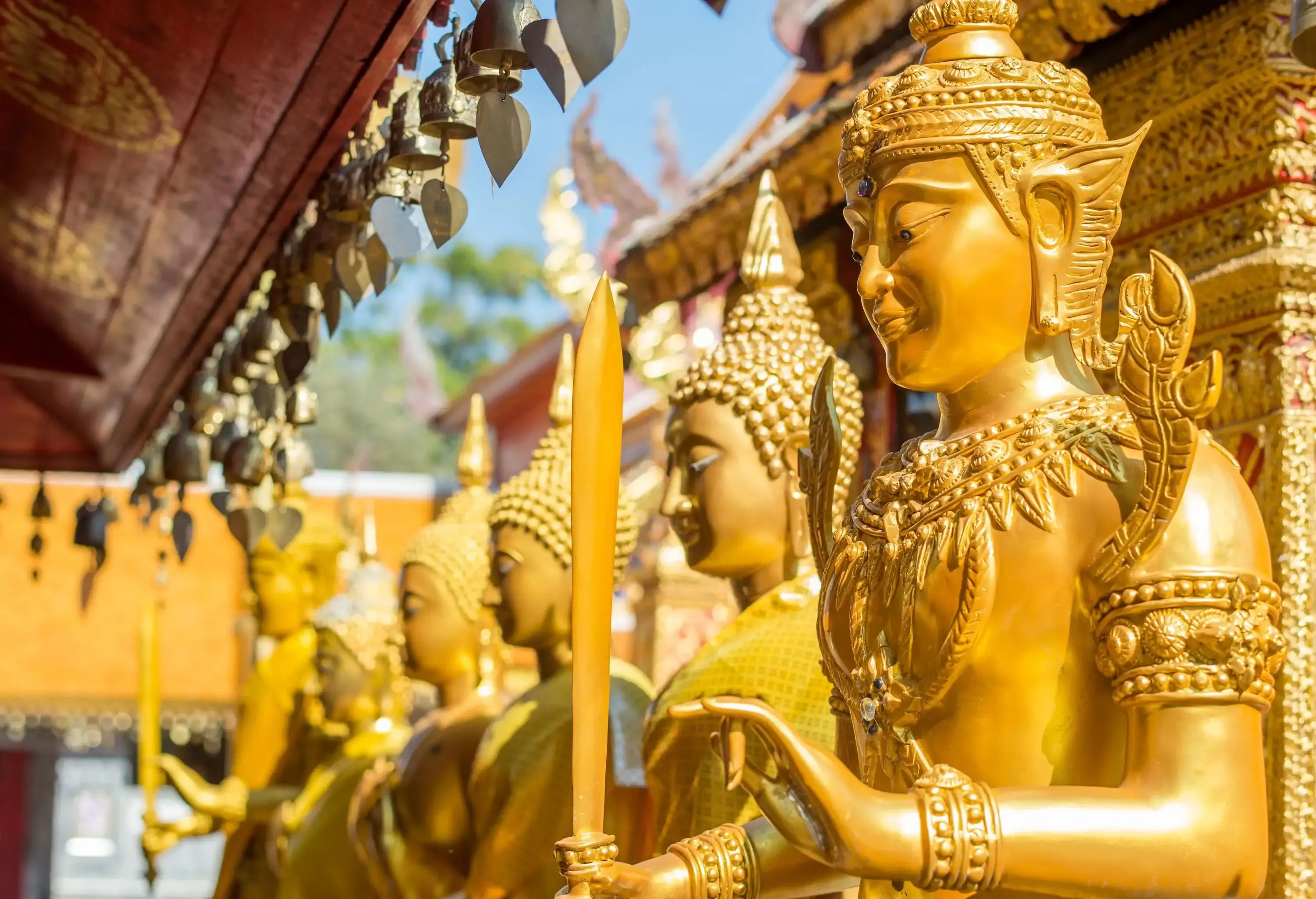 Golden Monk statues with various gestures formed a line.