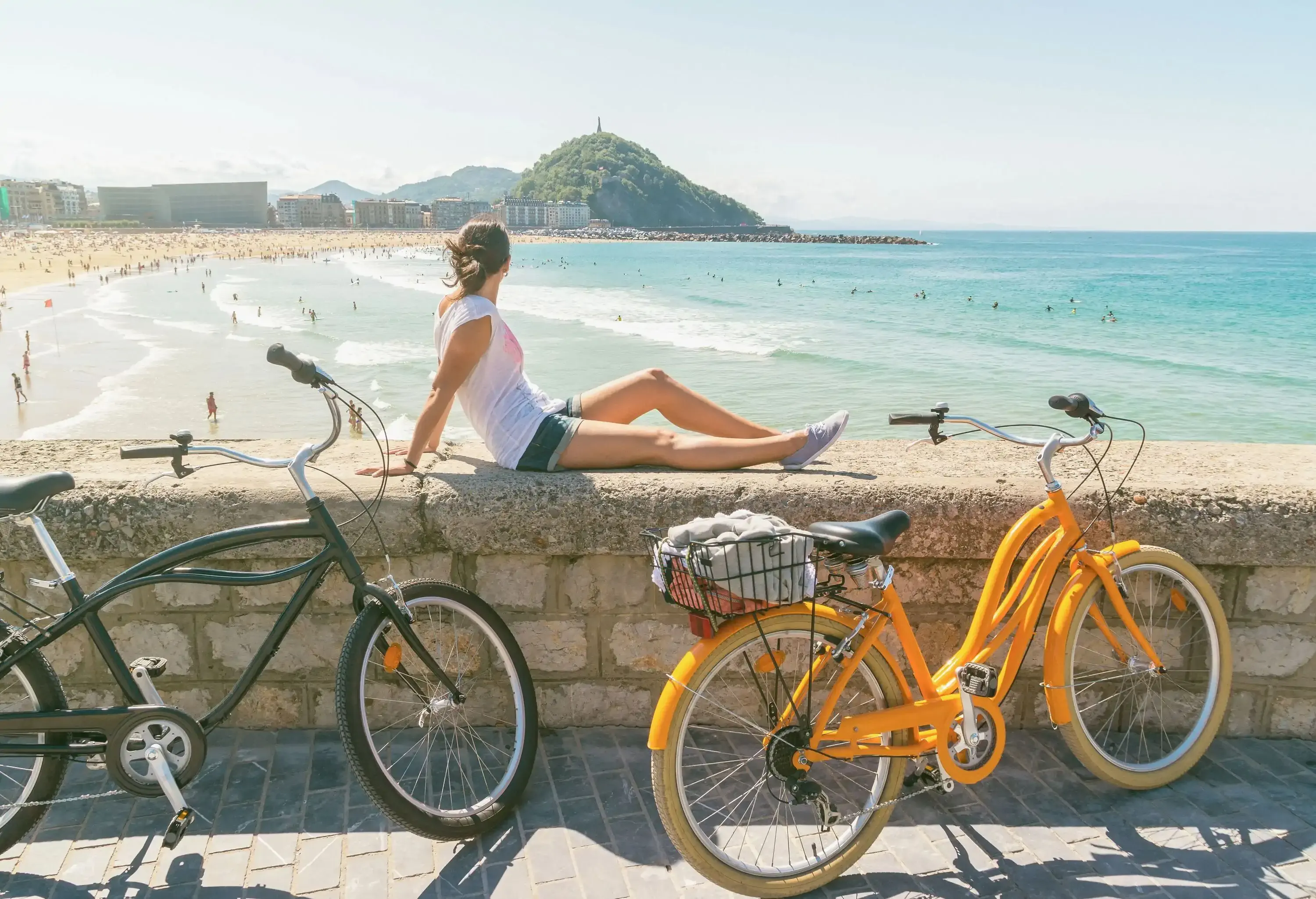 Young woman enjoying the view in San Sebastian at summer, Spain
