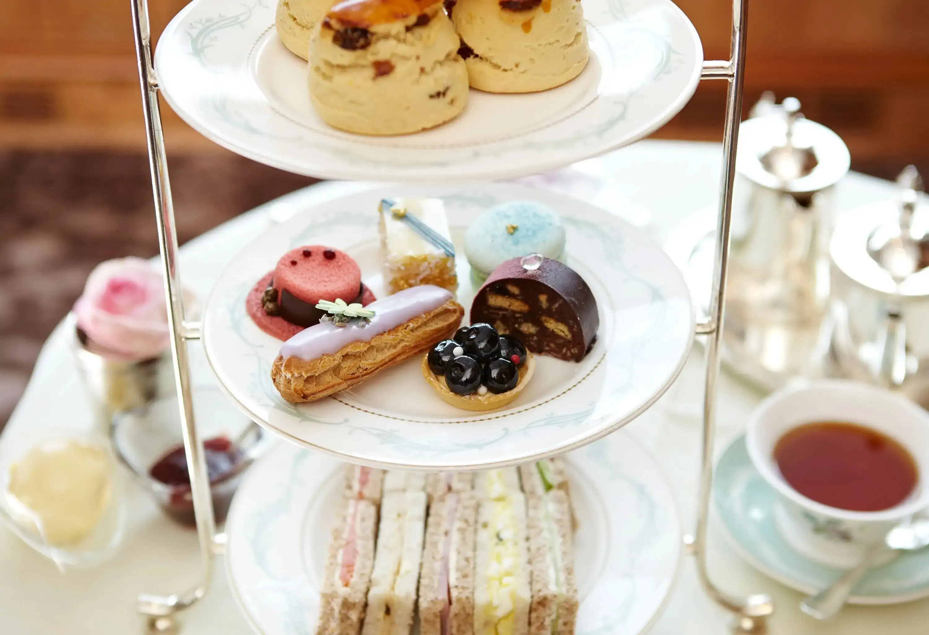 Cakes, sandwiches and tea in a restaurant
