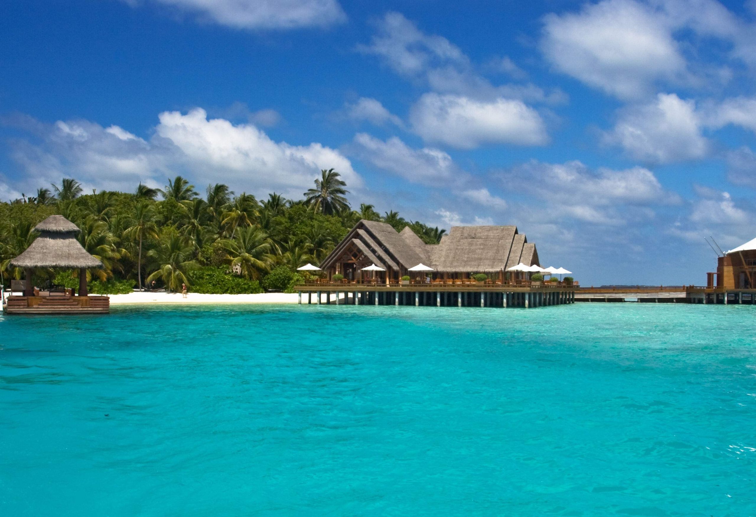 Overwater bungalows built on tropical seas close to the shore.