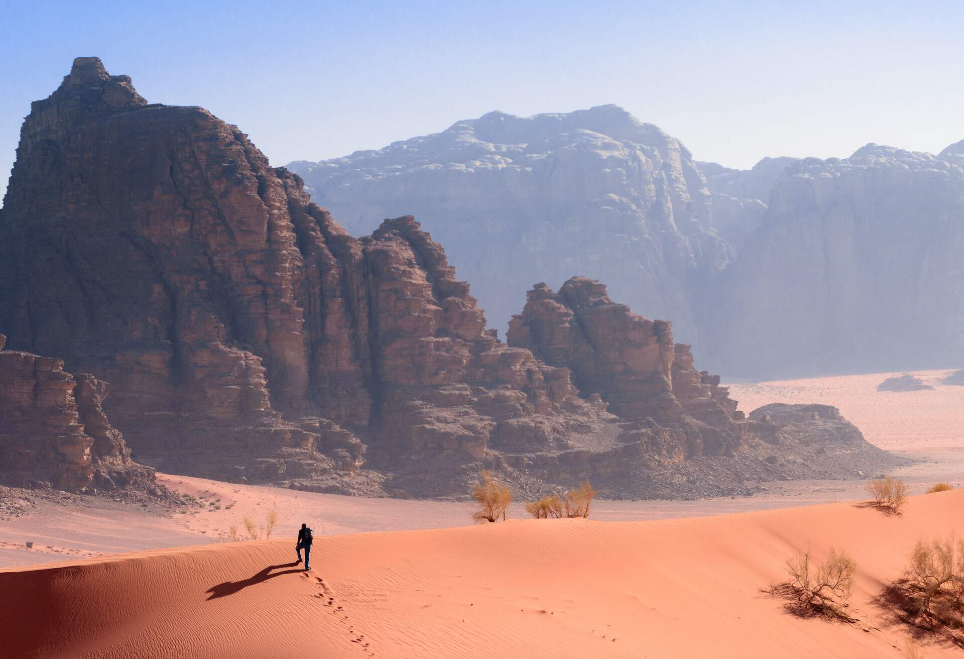 A Hiker on a Ridge in the Desert in Wadi Rum, Jordan