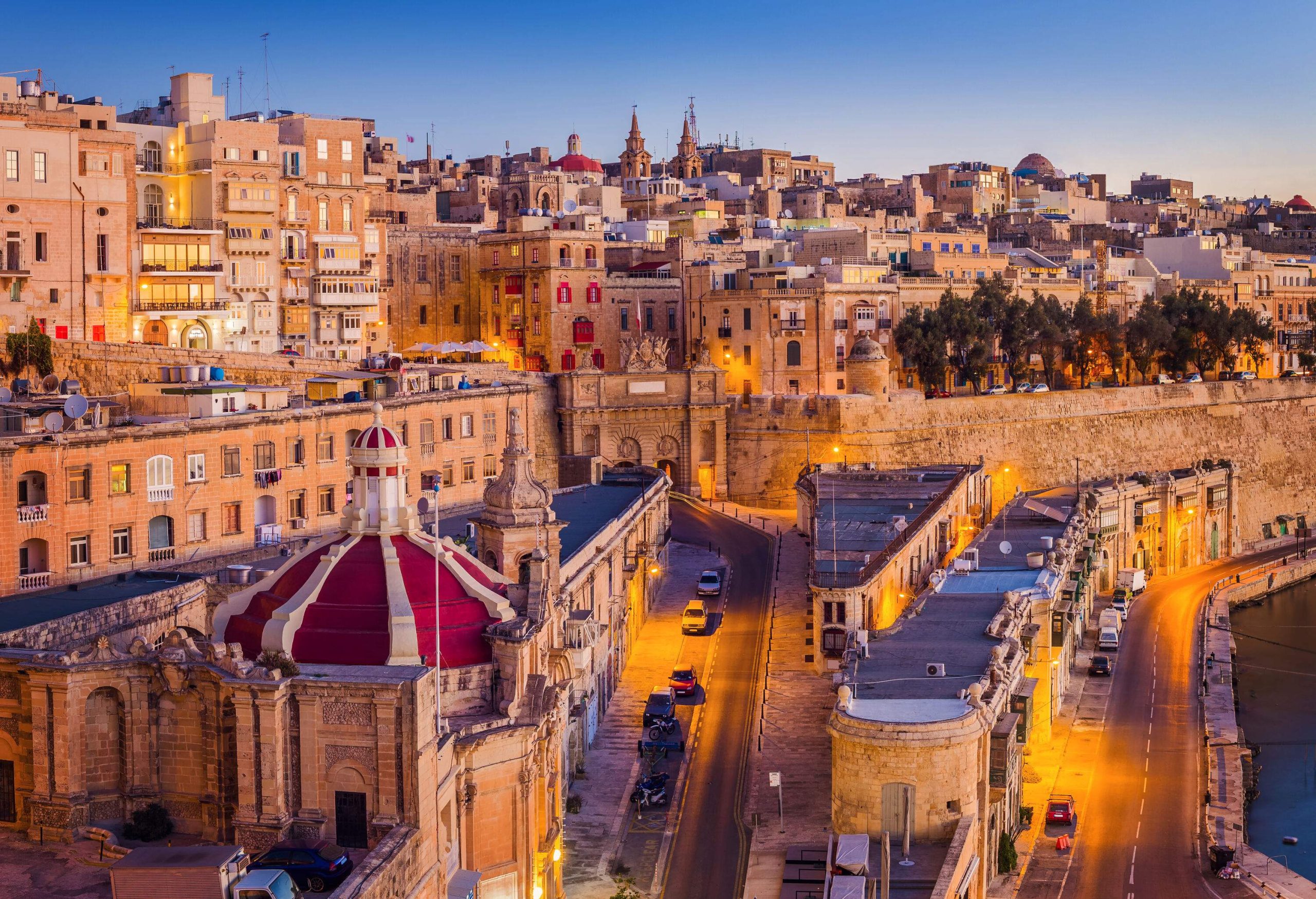 Aerial view of an old city showcasing a harmonious blend of historic fortifications, Baroque architecture, and stunning Mediterranean views.