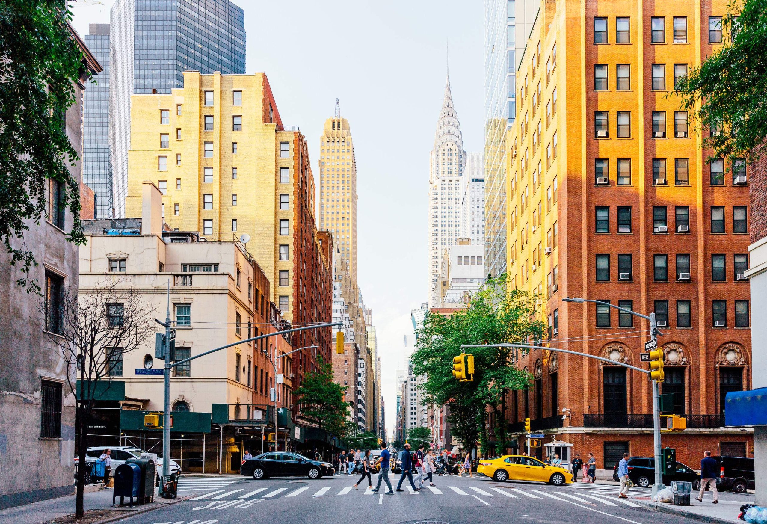 The bustling streets of New York surrounded by its remarkable architecture.