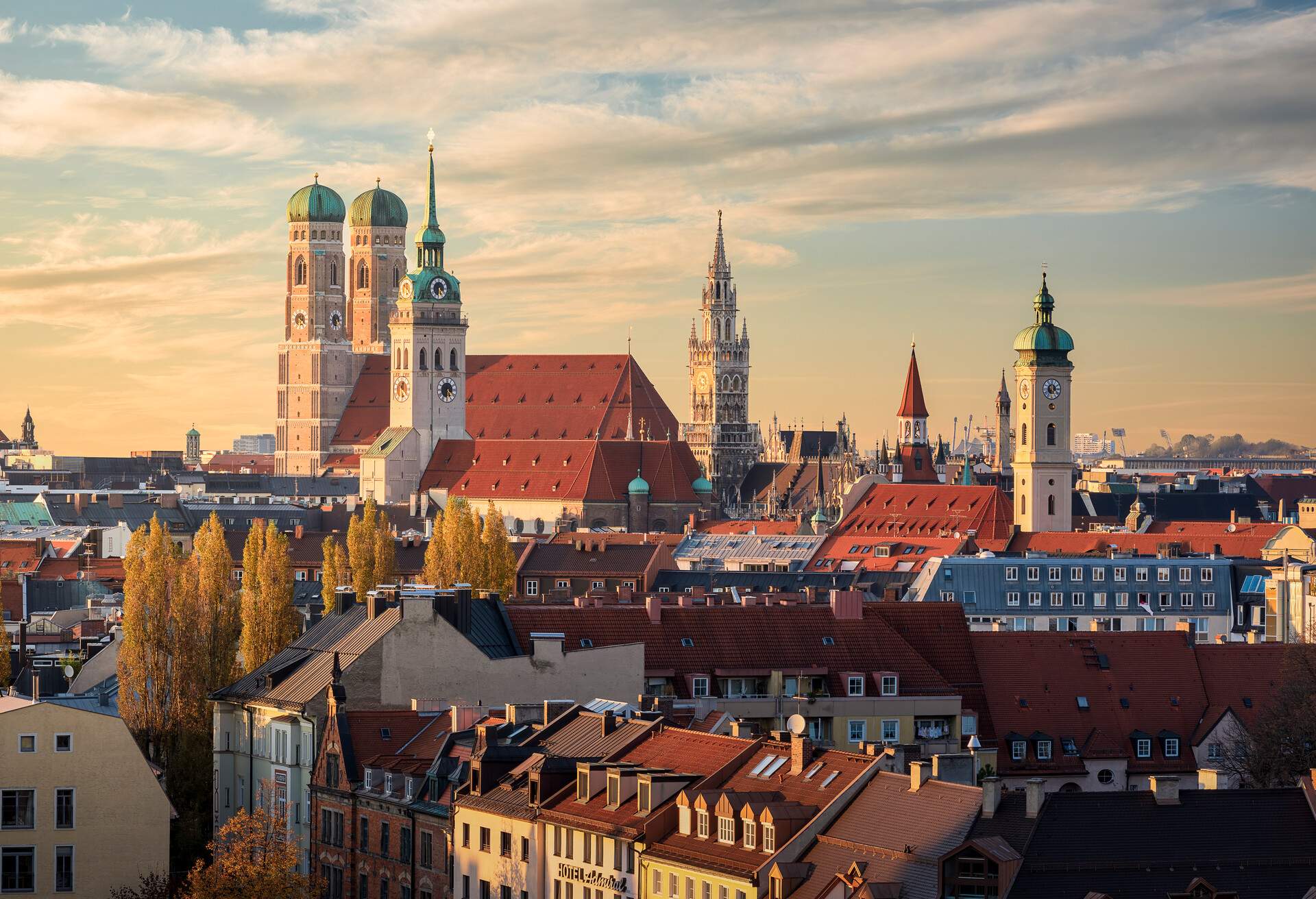 A cathedral with two front domes and several different towers stands out against the beautiful skyline of buildings.