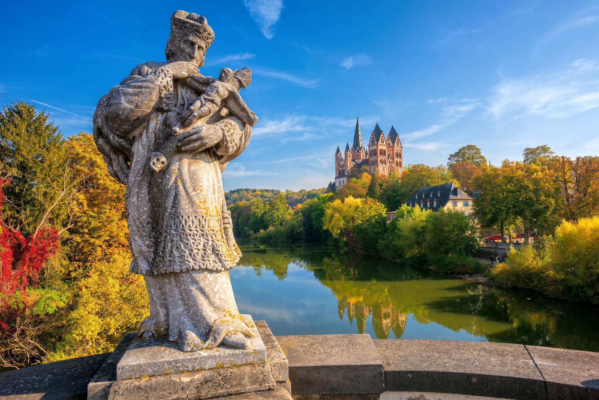 Limburg an der Lahn town, Hesse, Germany, view of the catholic cathedral with Saint John of Nepomuk statue on the medieval Old Lahn bridge