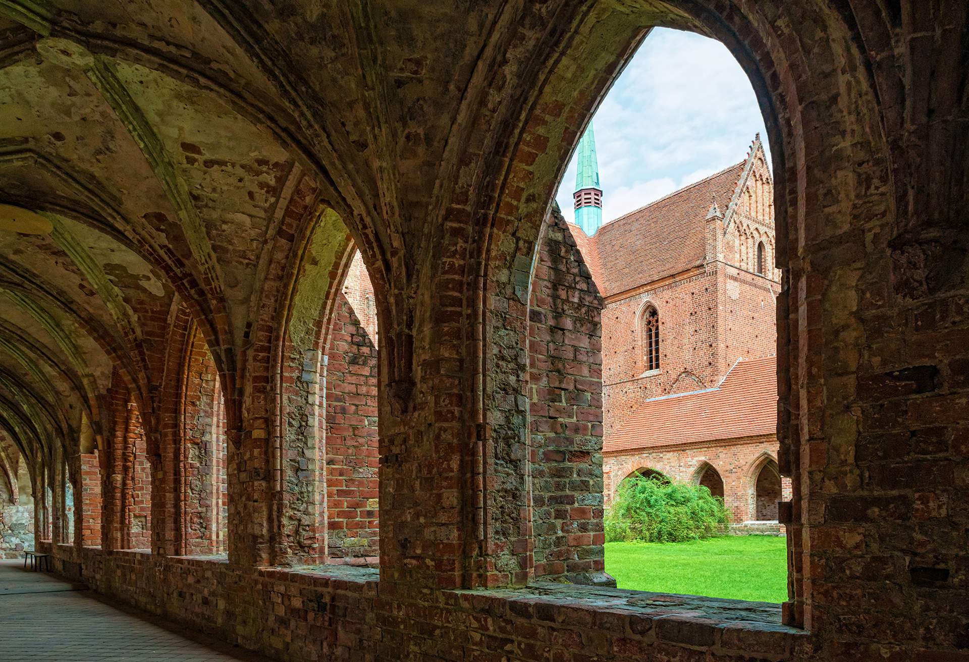 VIEW OF CHORIN CLOISTER THROUGH AN ARCH