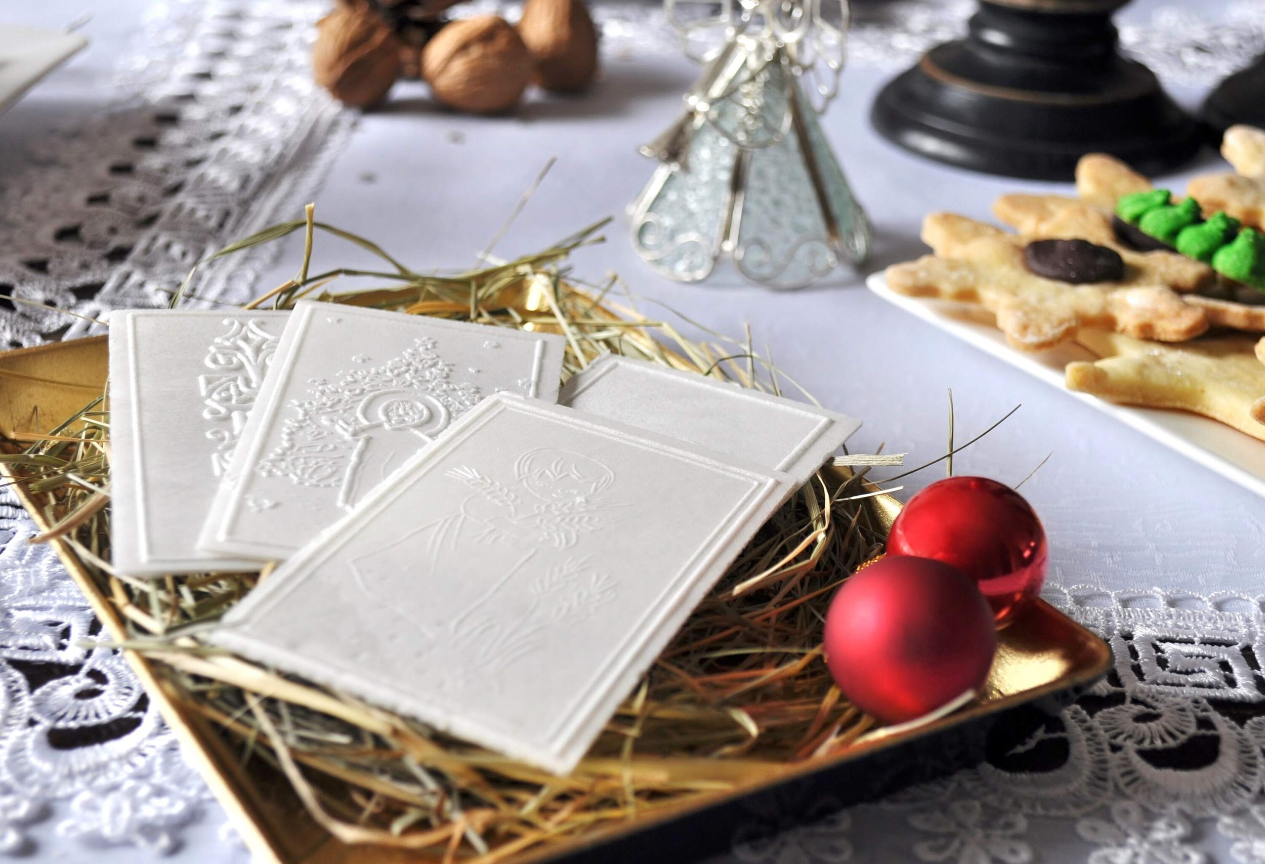 Polish traditional Christmas wafer on hay.