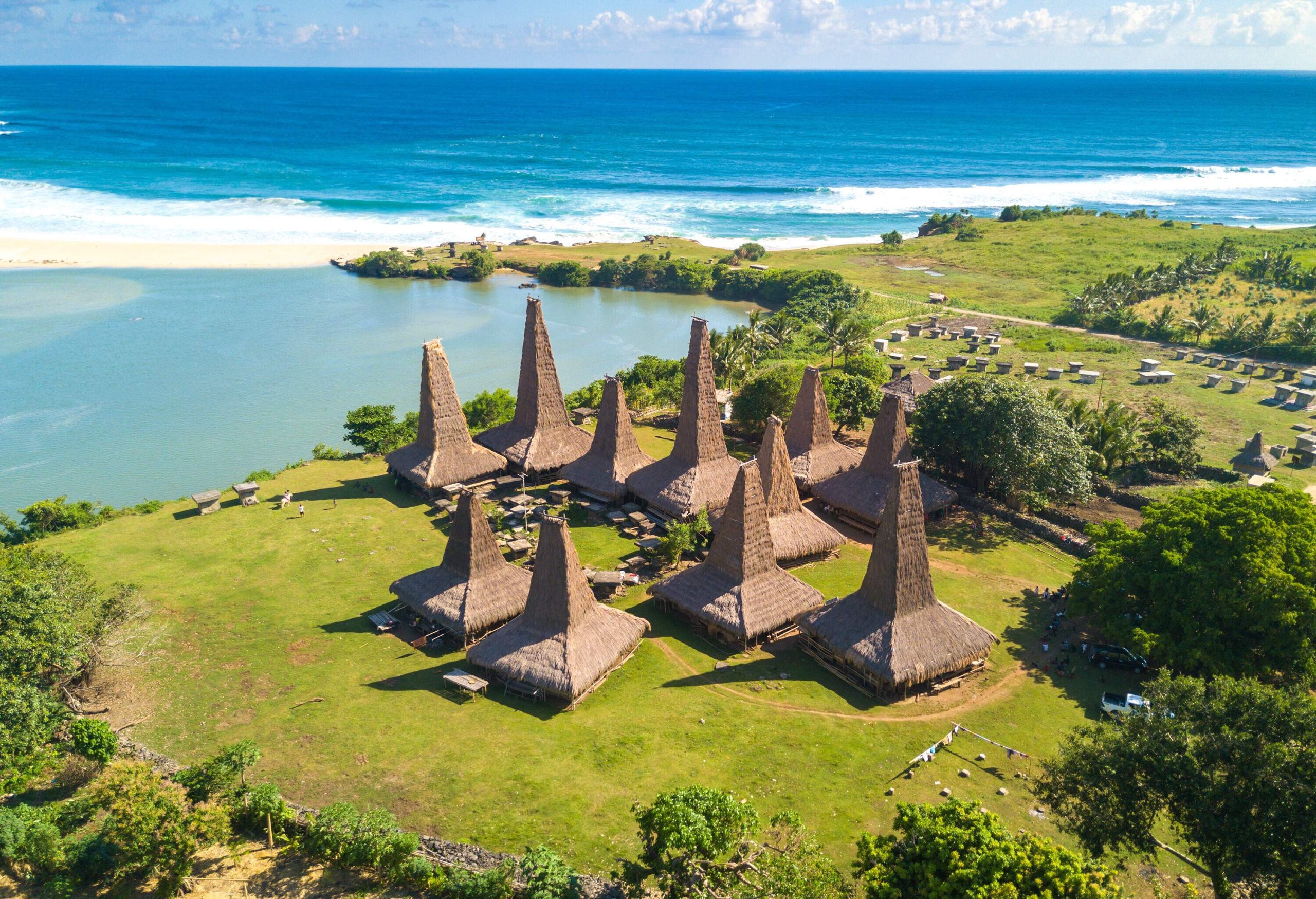 Aerial view of a traditional seaside village of unique architecture houses with distinctive triangular thatched roofs.