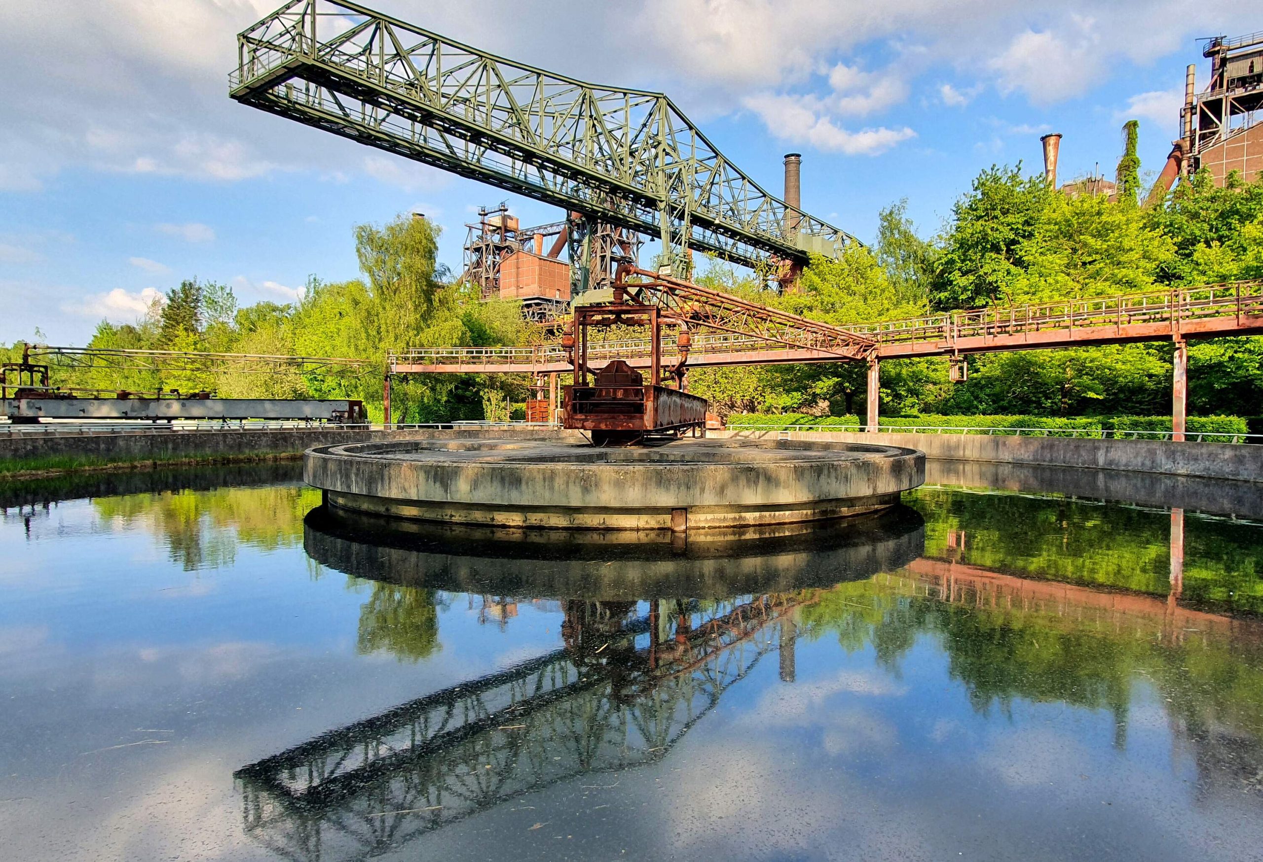 The ore loading bridge (''The crocodile'') with reflection in the clarifier in the Duisburg Landscape Park (Landschaftspark Duisburg-Nord)