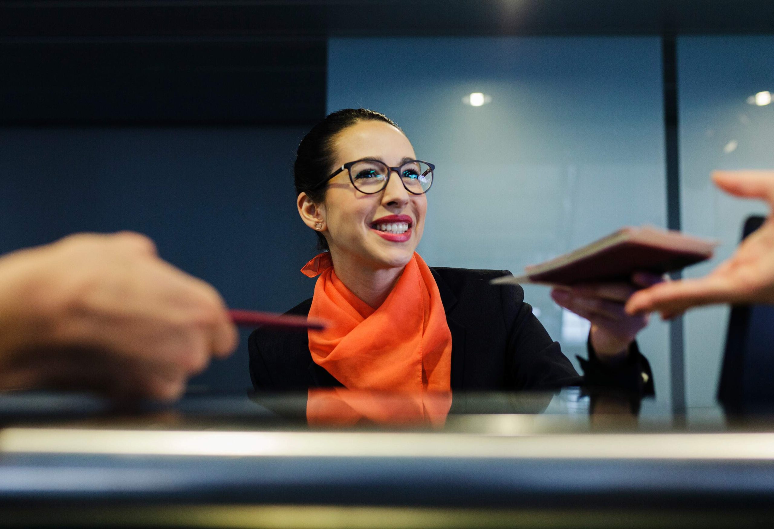 theme_people_woman_counter_airport_passport_gettyimages-638838742-copy