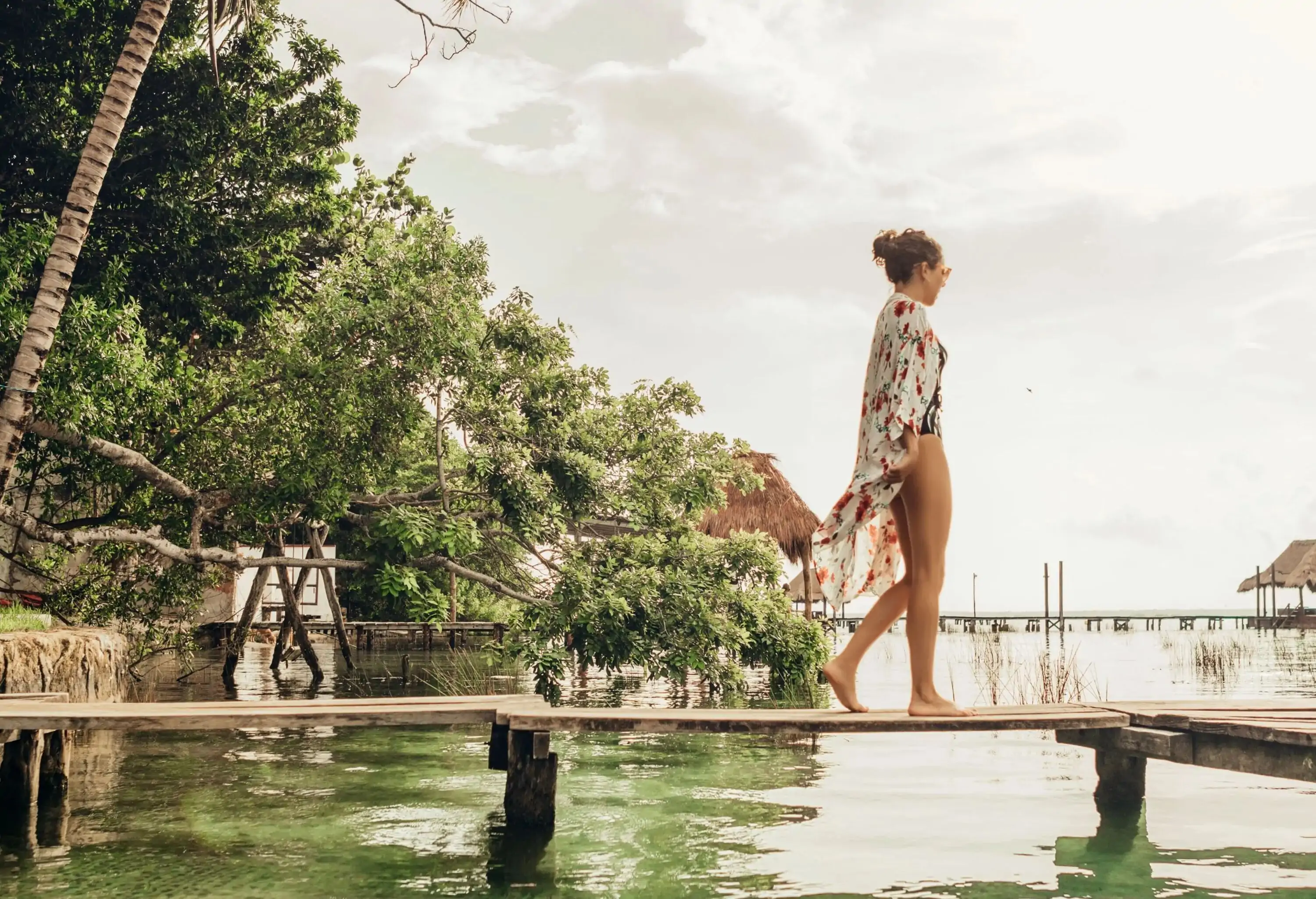 Woman walking on a pier at a lagoon