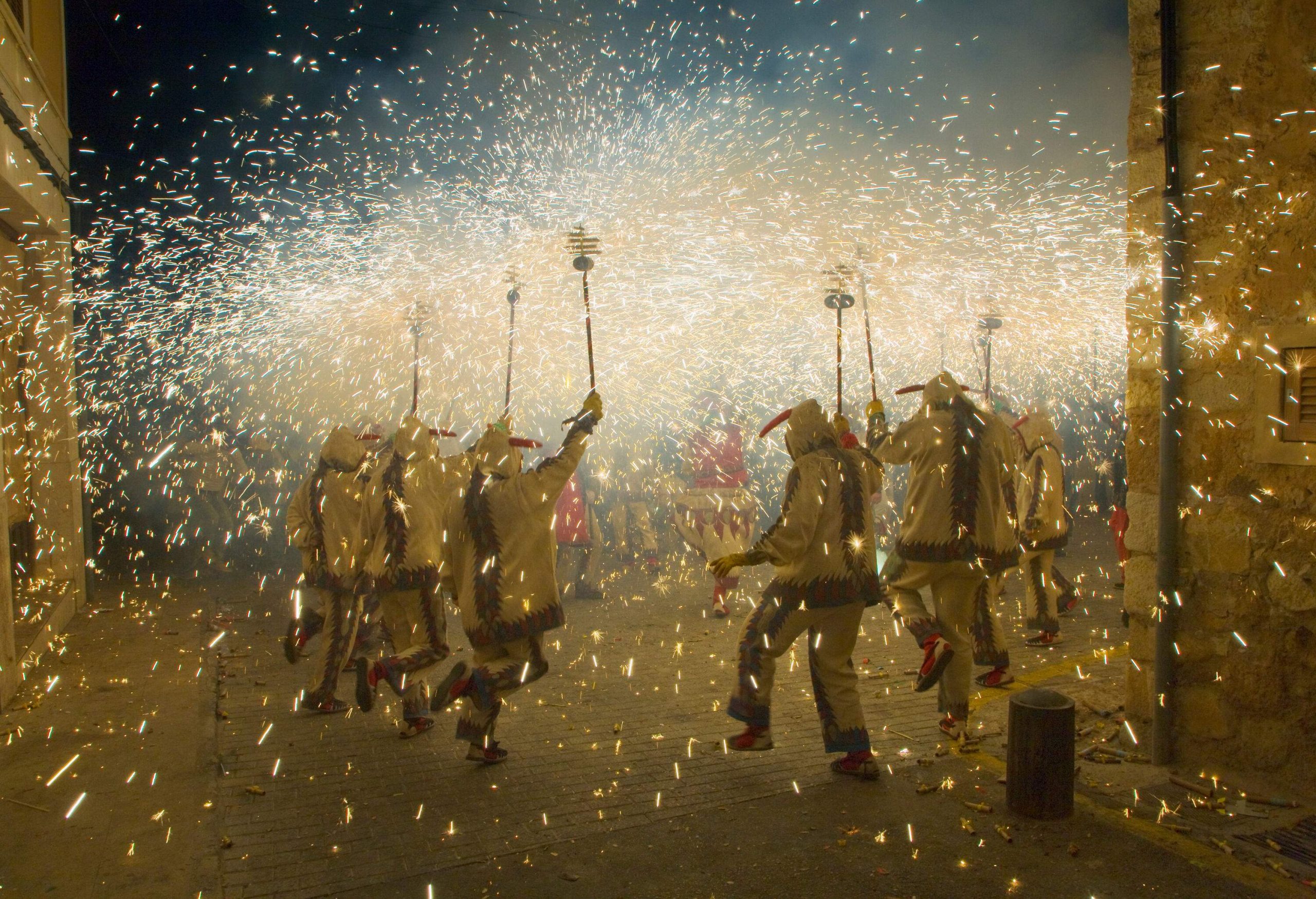 A festival in which revellers dressed as the devil dance in the streets while holding a stick that ignites fireworks.