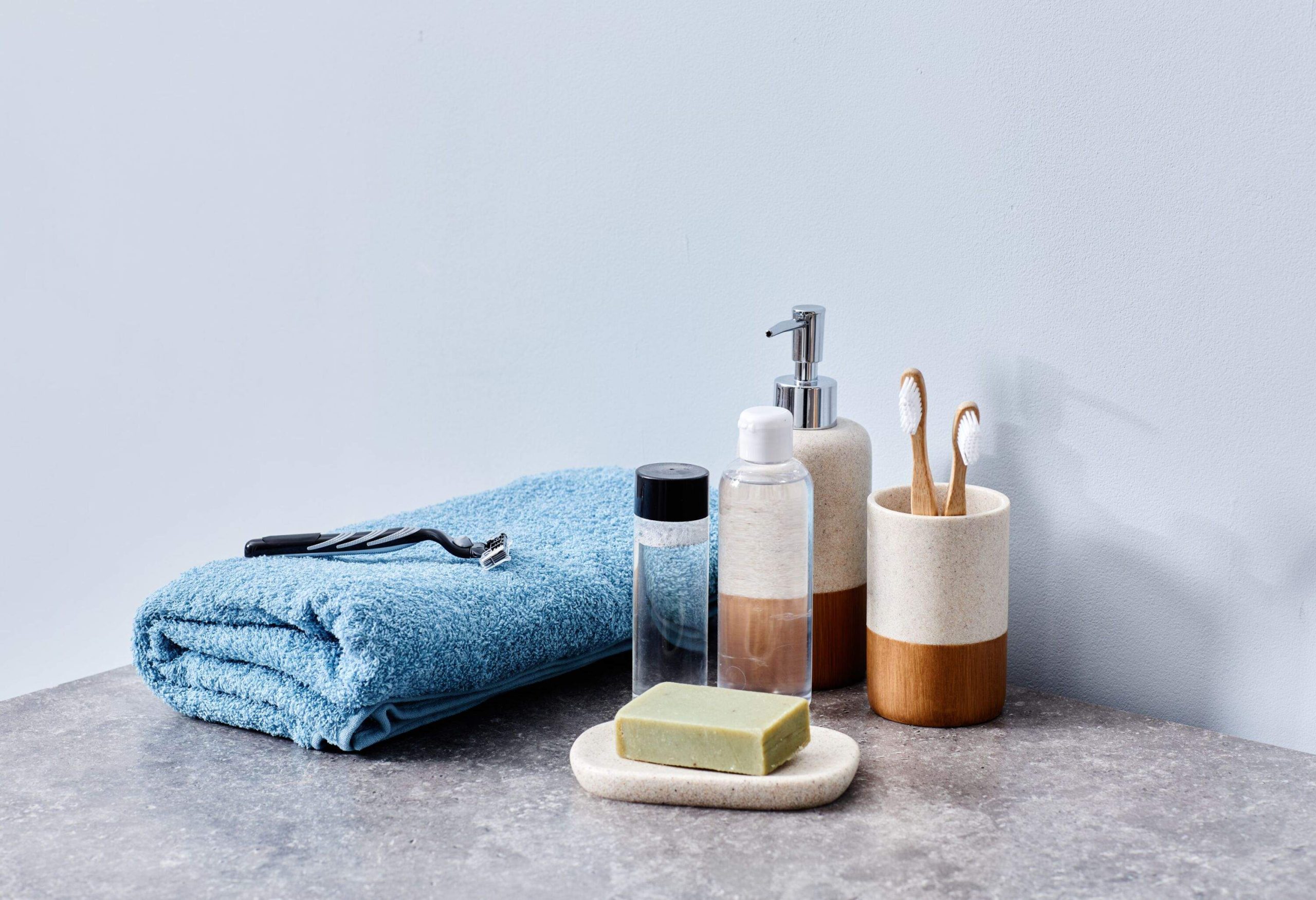 Image of hygiene products for body care on toilet table in bathroom