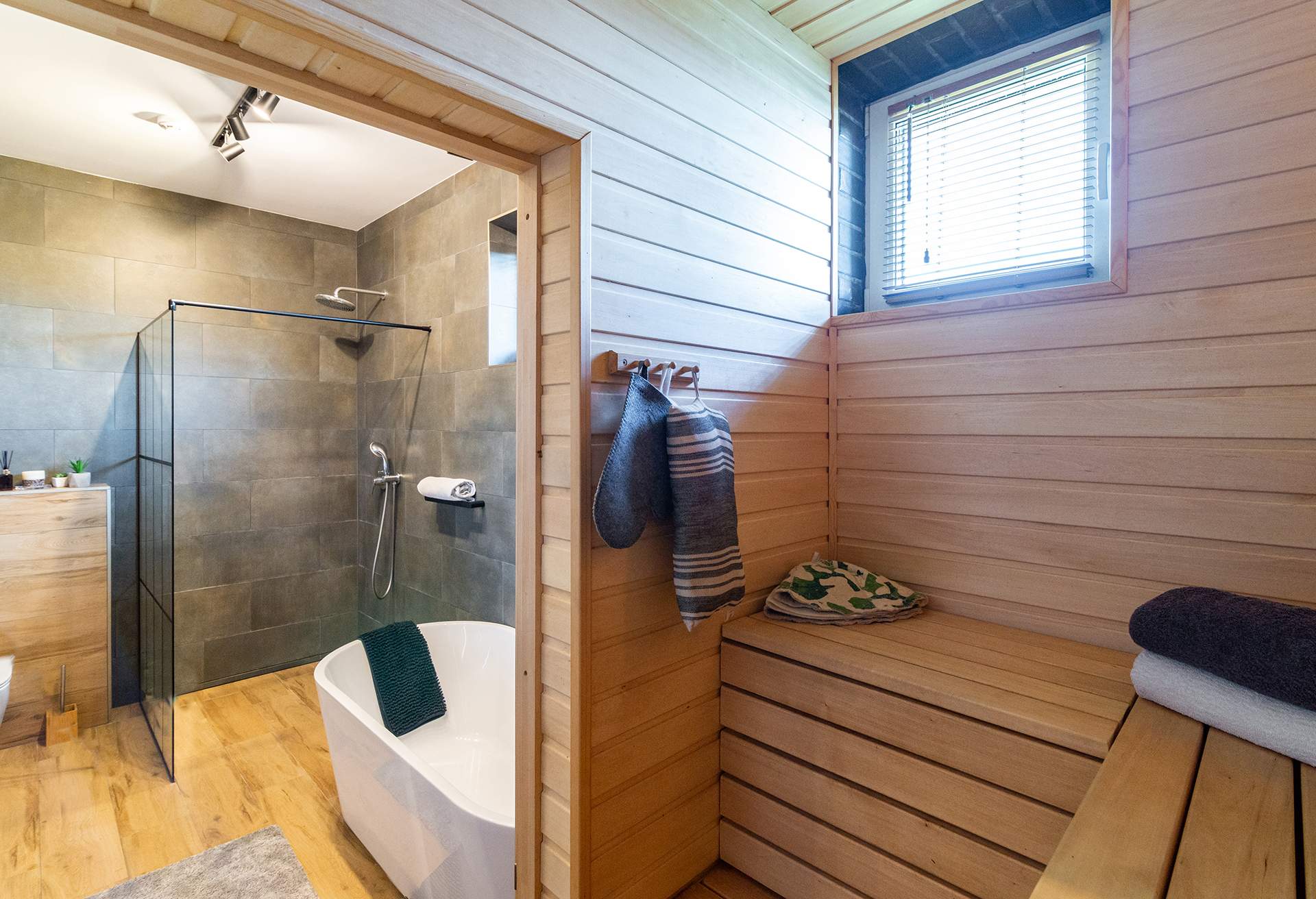 Modern hotel bathroom with sauna attached to the room