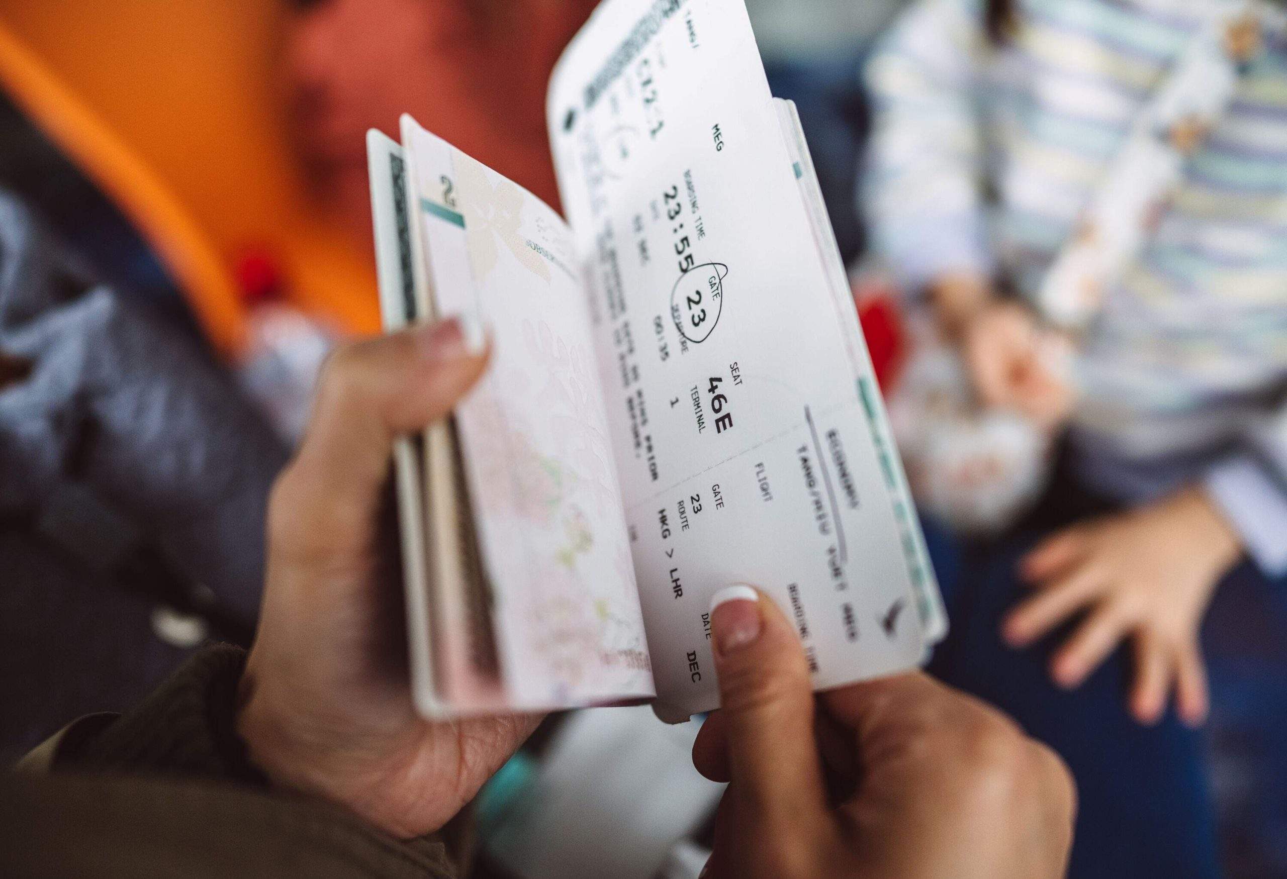 Cropped shot of a female traveller checking her boarding pass & passport at the boarding gate in the airport.