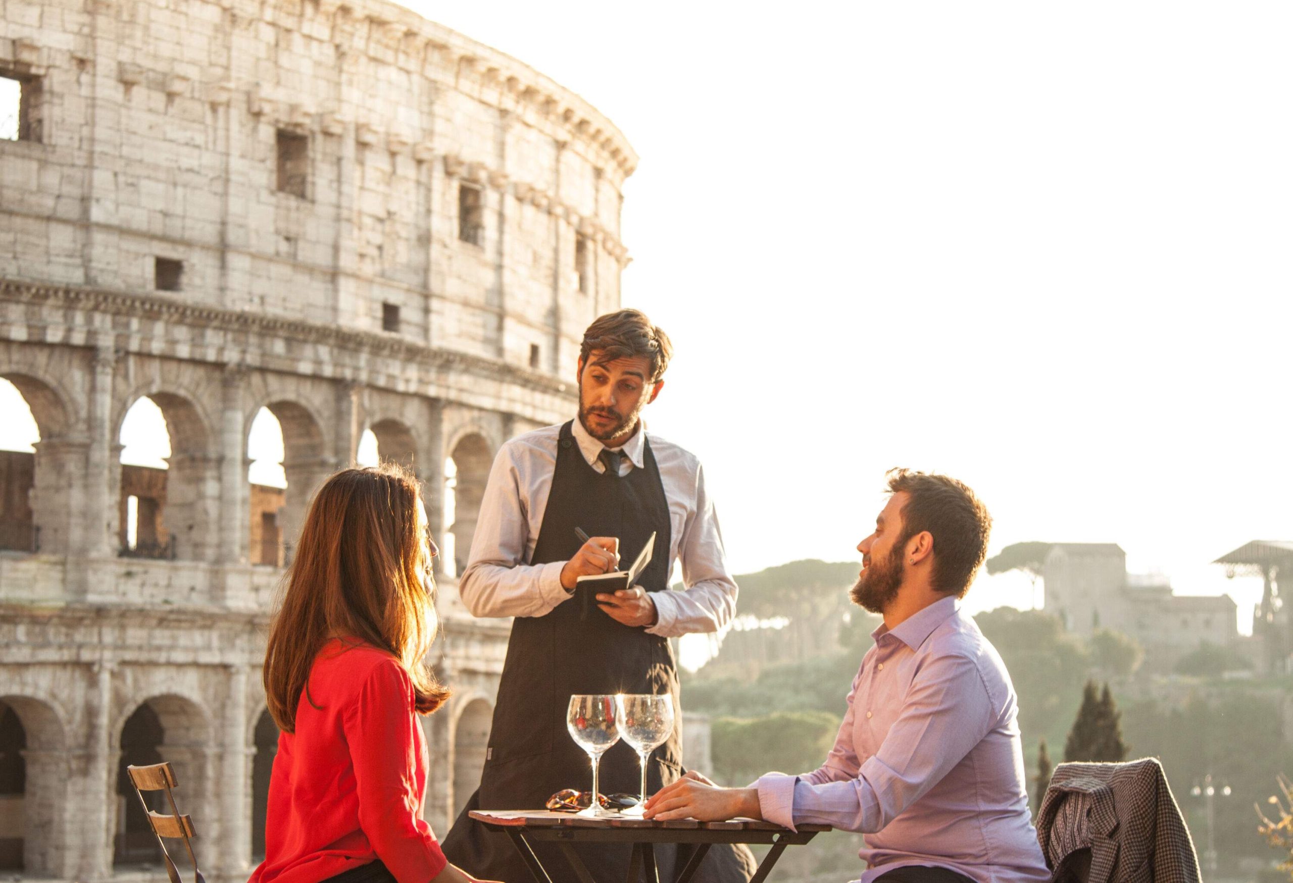 Two individual orders in a restaurant with the Roman Colosseum in the background.