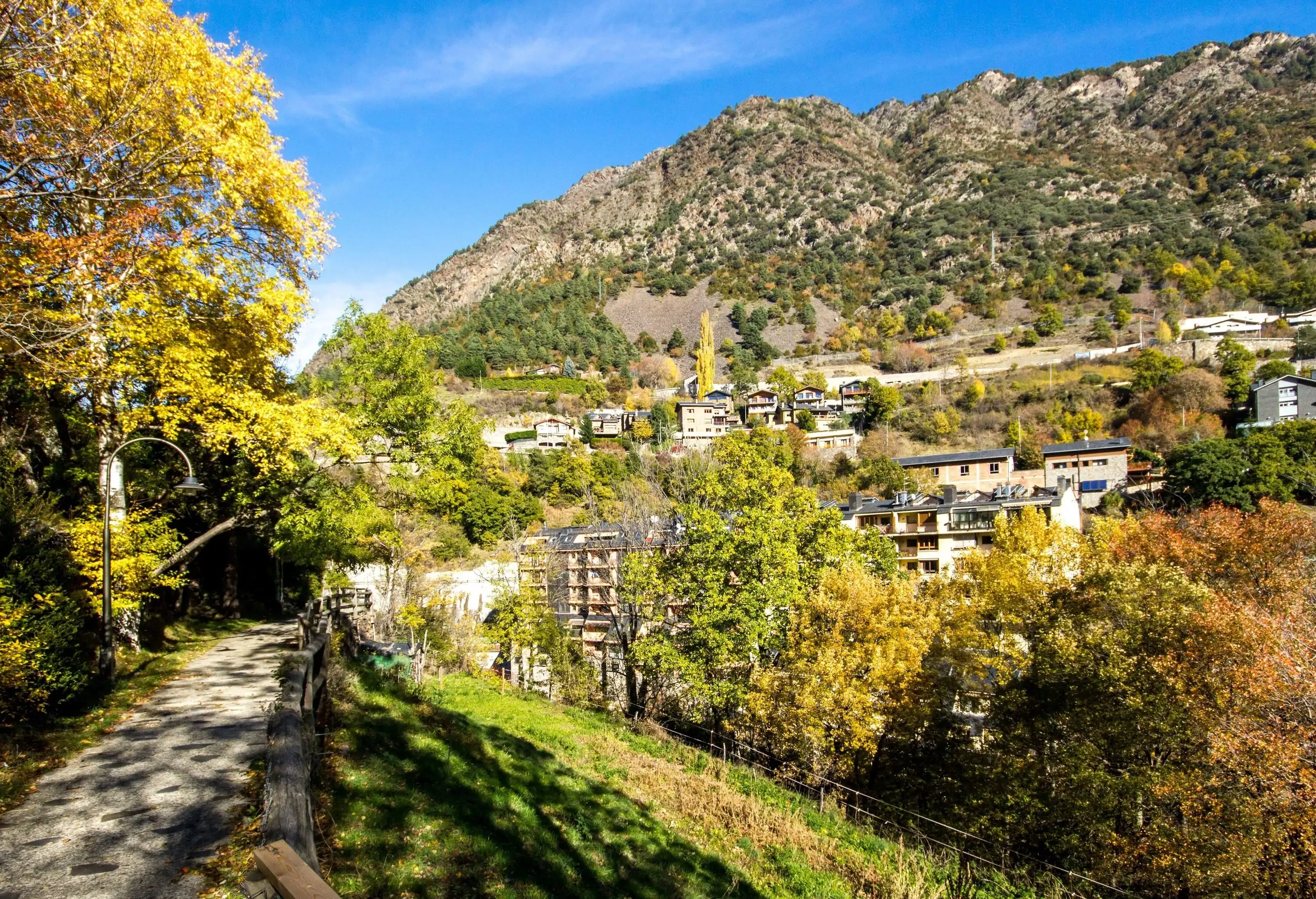 Path and houses on the slopes of the Pyrenees mountains
