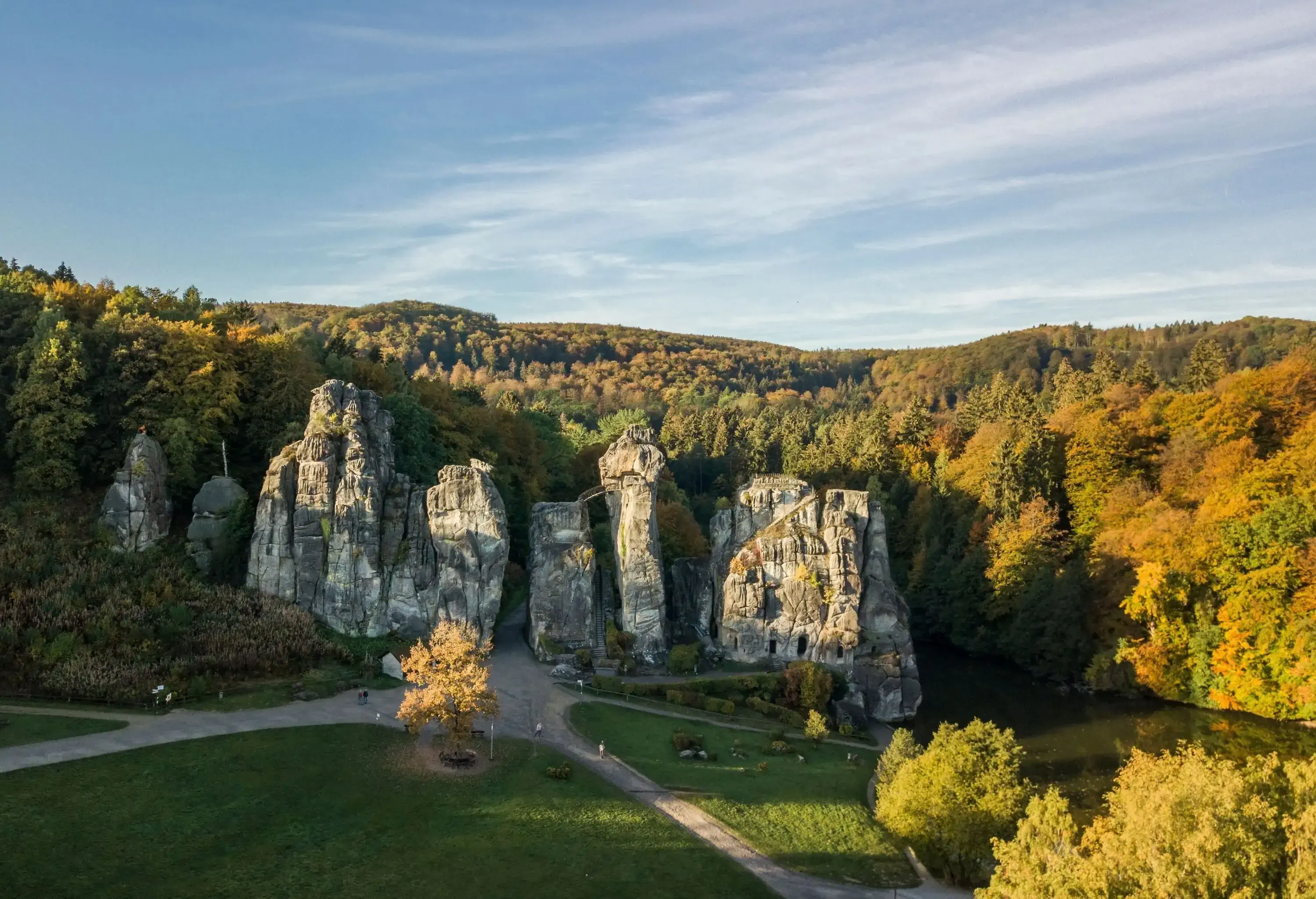 Narrow rock pillars that abruptly emerge from the surrounding forested hills.