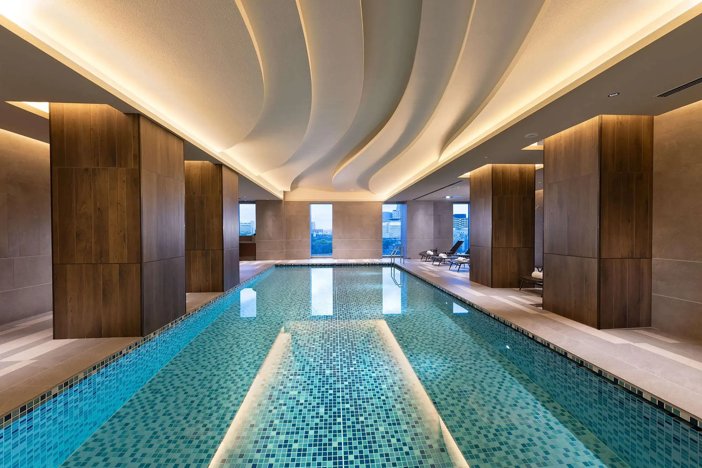 Indoor pool of luxury hotel with city view
