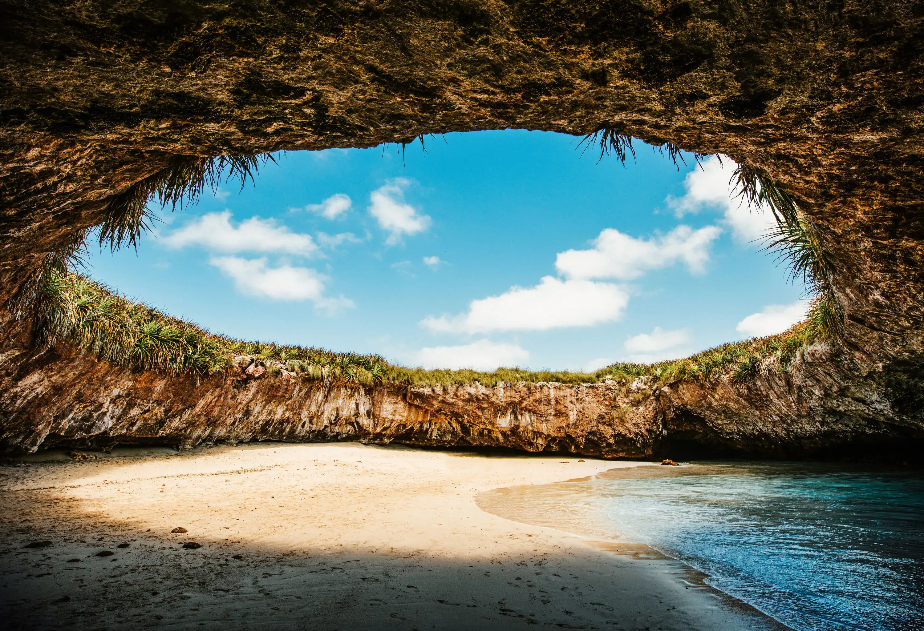 A small beach hidden inside a cavern.