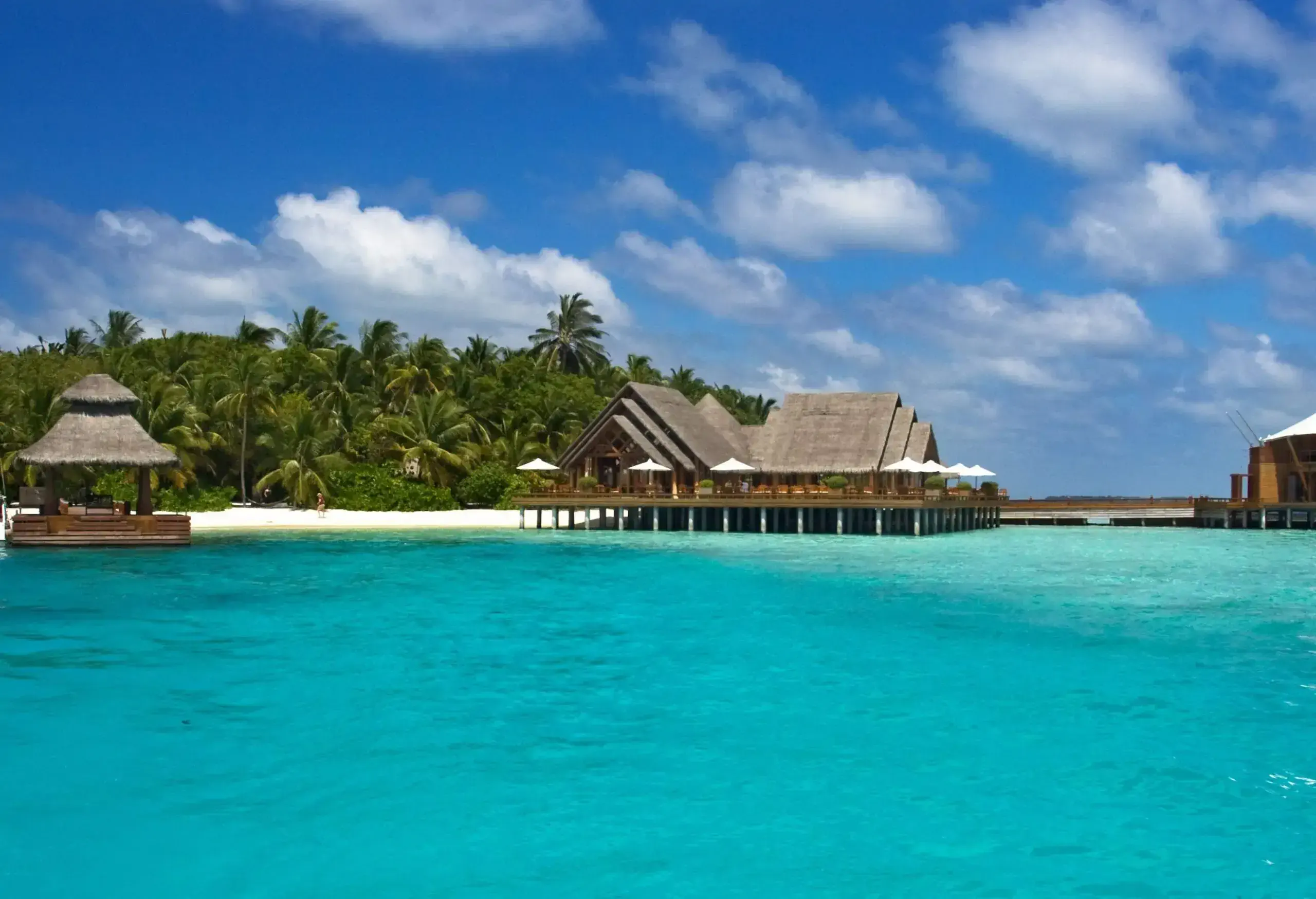 Overwater bungalows built on tropical seas close to the shore.