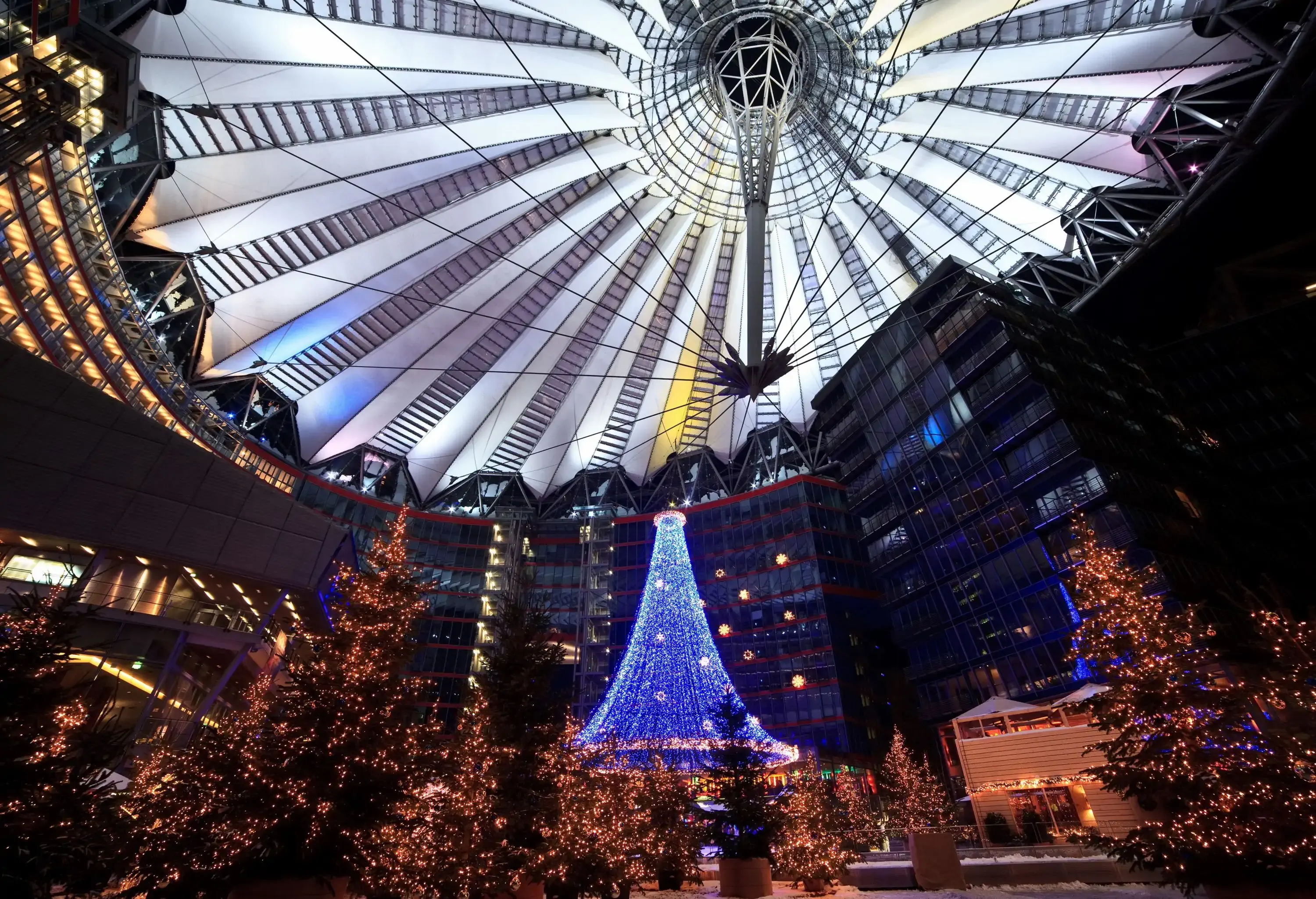 Christmas market at night in modern building