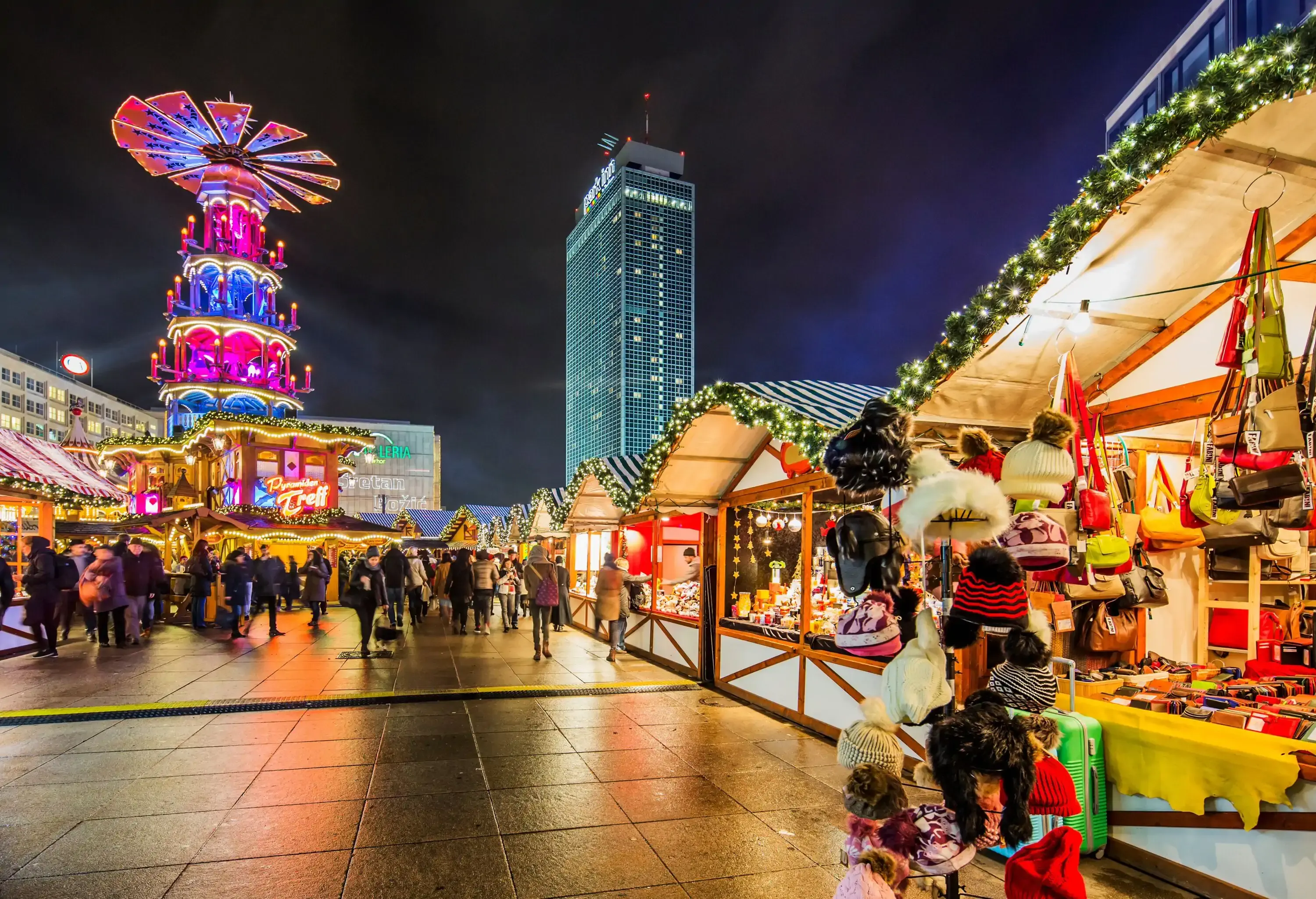 Germany, Berlin, Berlin . Alexanderplatz Christmas Market, on the background illuminated tall building