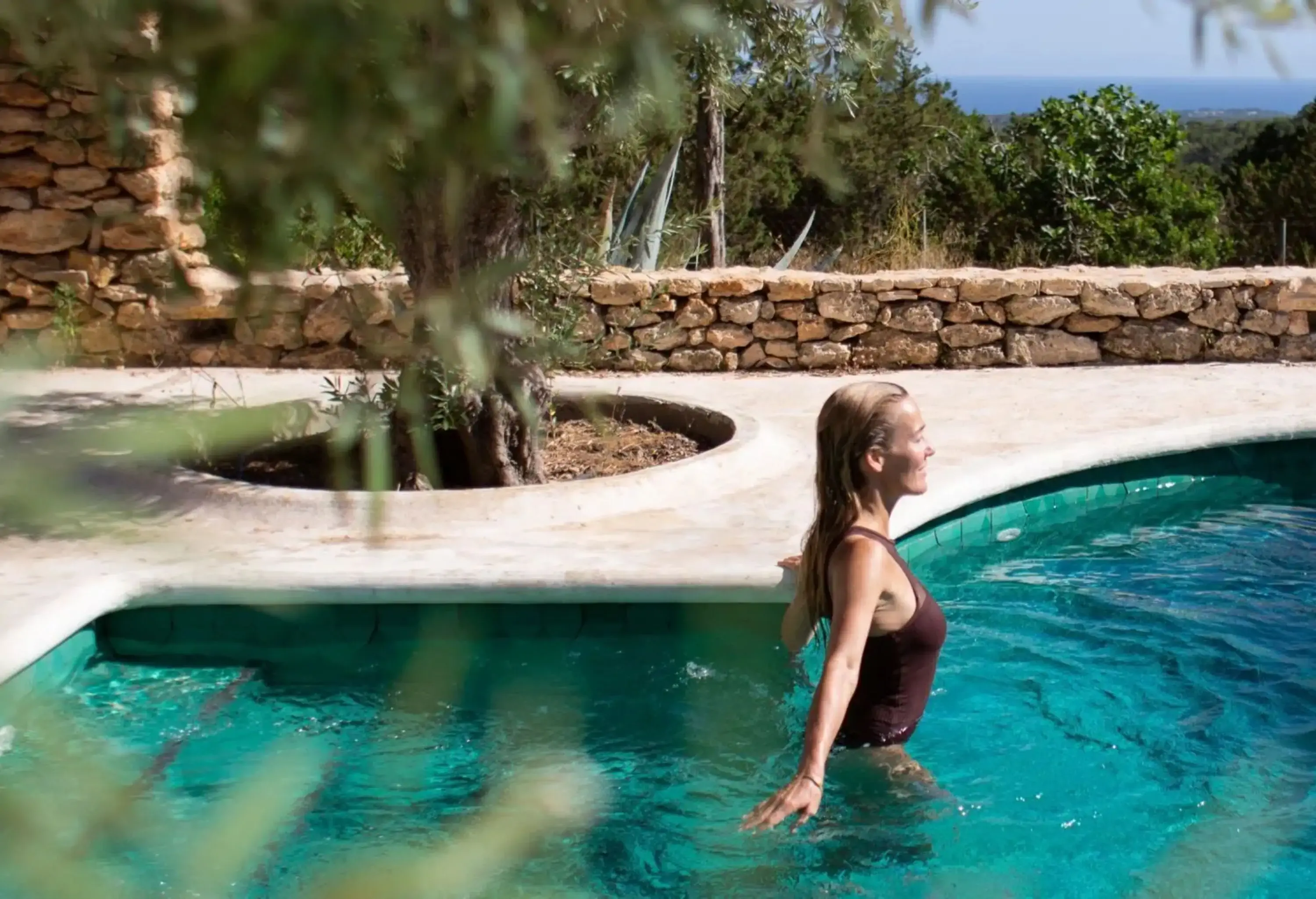 Woman going for a swim in outdoors pool