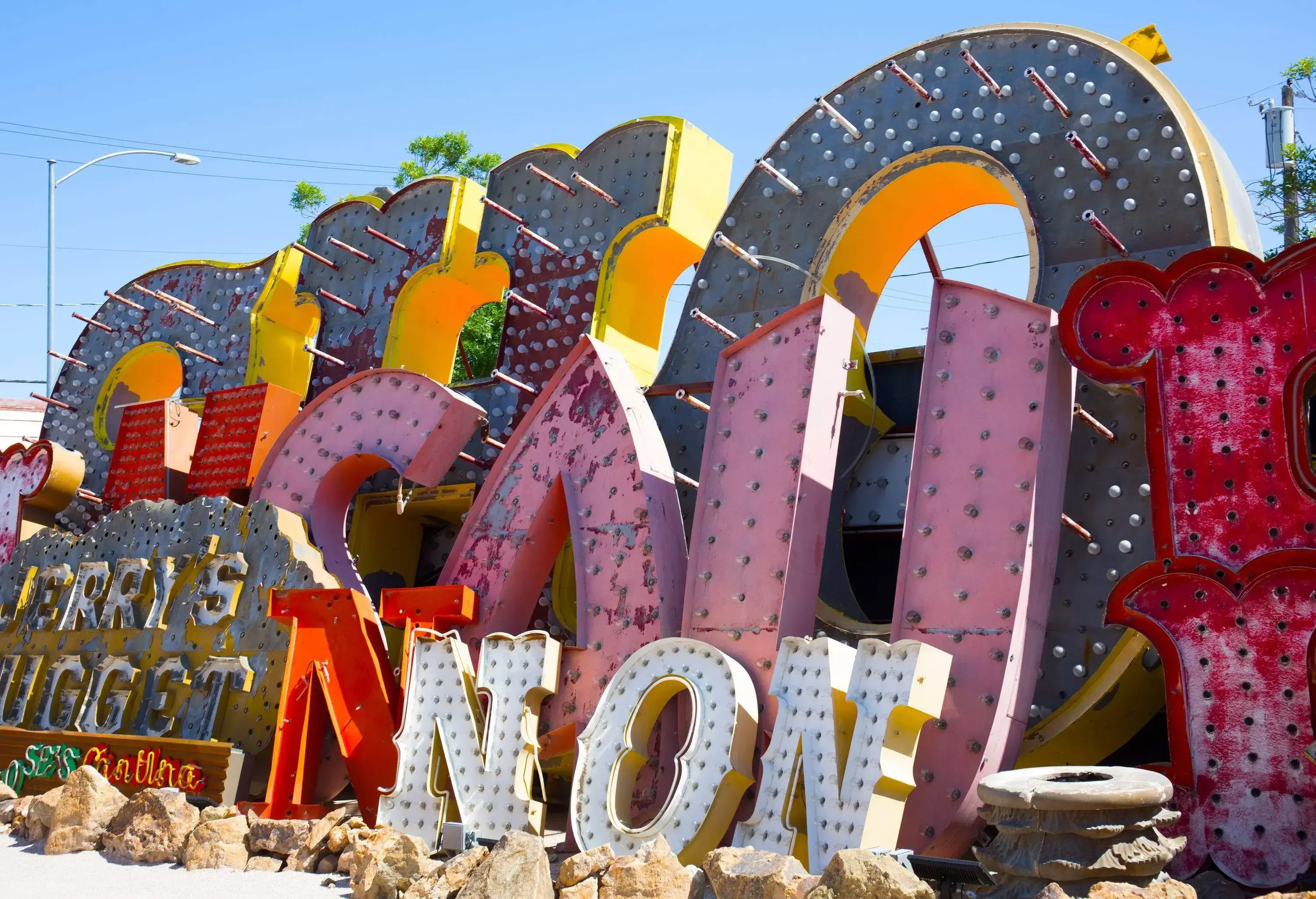 A jumble of marquee lettering and store signs along a debris path.