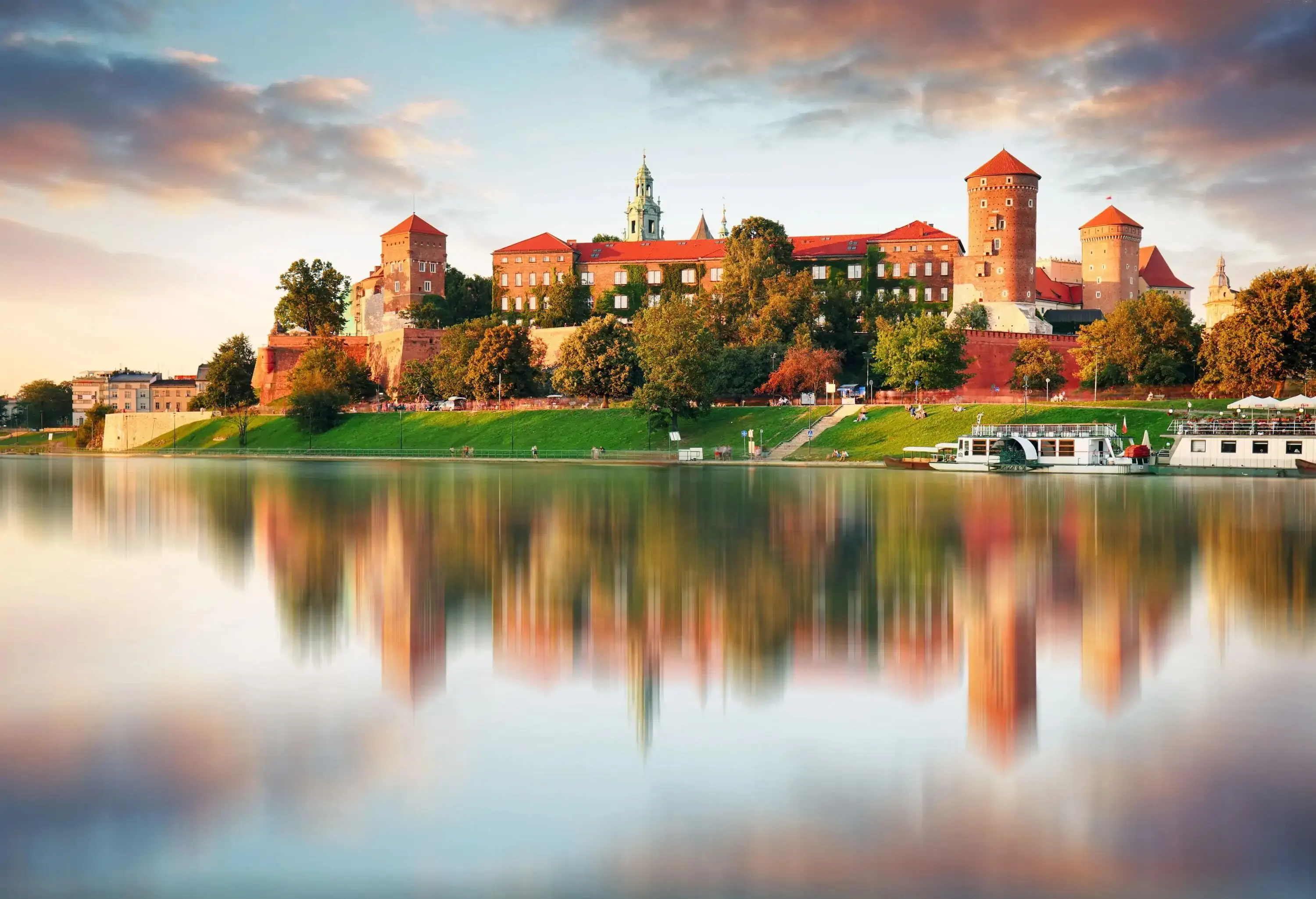 Wawel hill with castle in pink light of sunset, Krakow, Poland