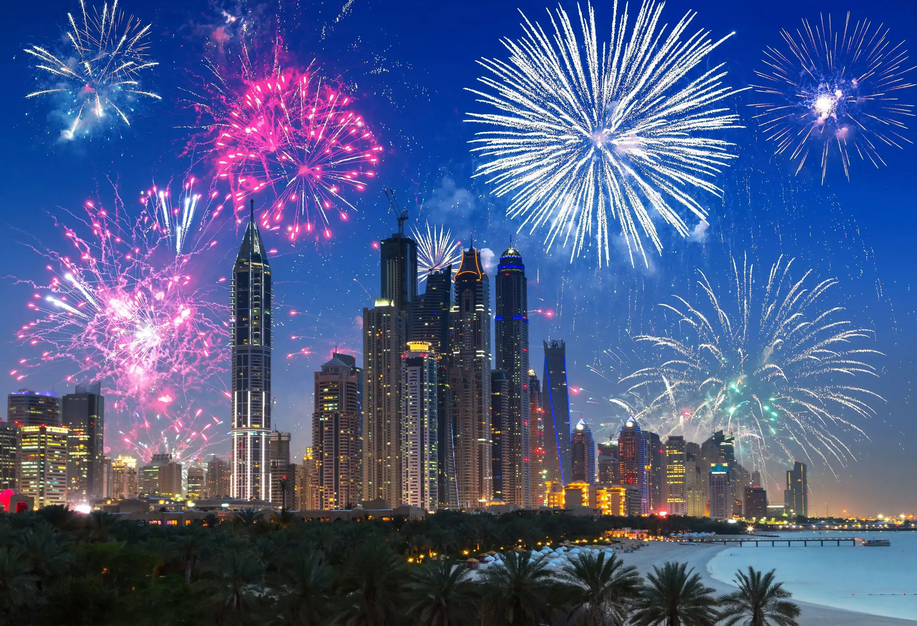 Stunning cityscape with dazzling skyscrapers and a blazing fireworks show.