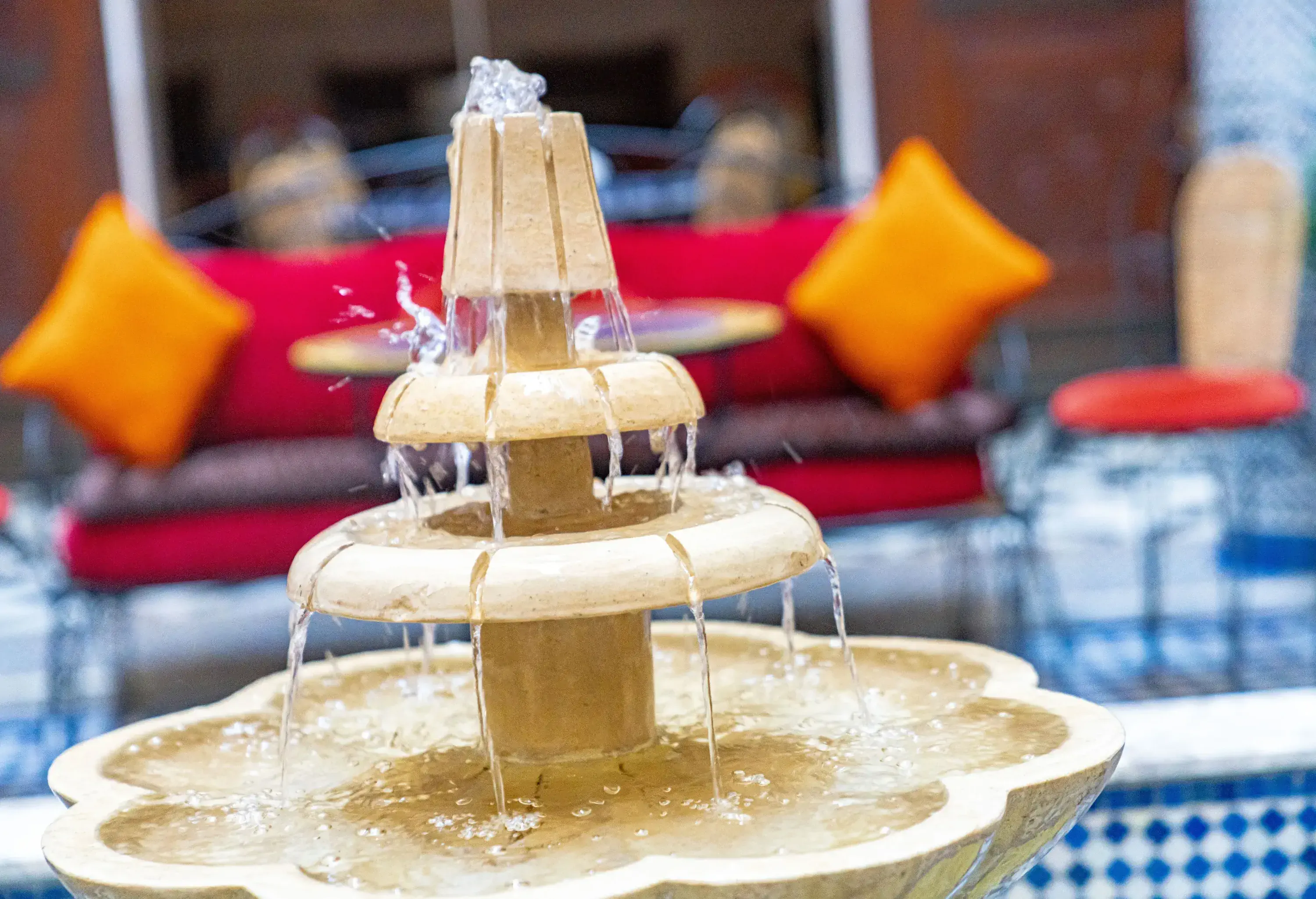 A small tiered fountain with flowing water.