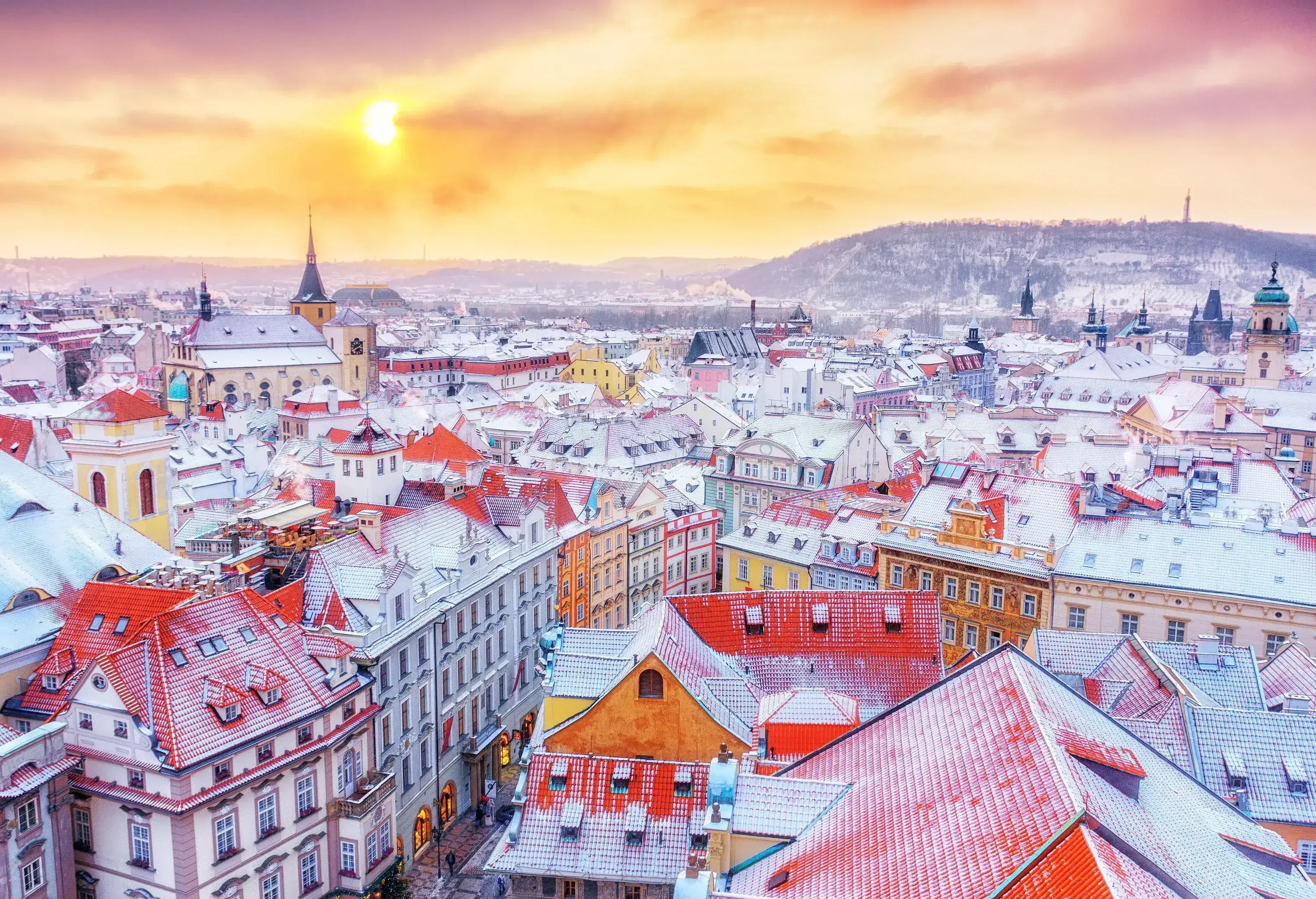 Snowy roofs of adjacent Baroque and Renaissance city buildings.