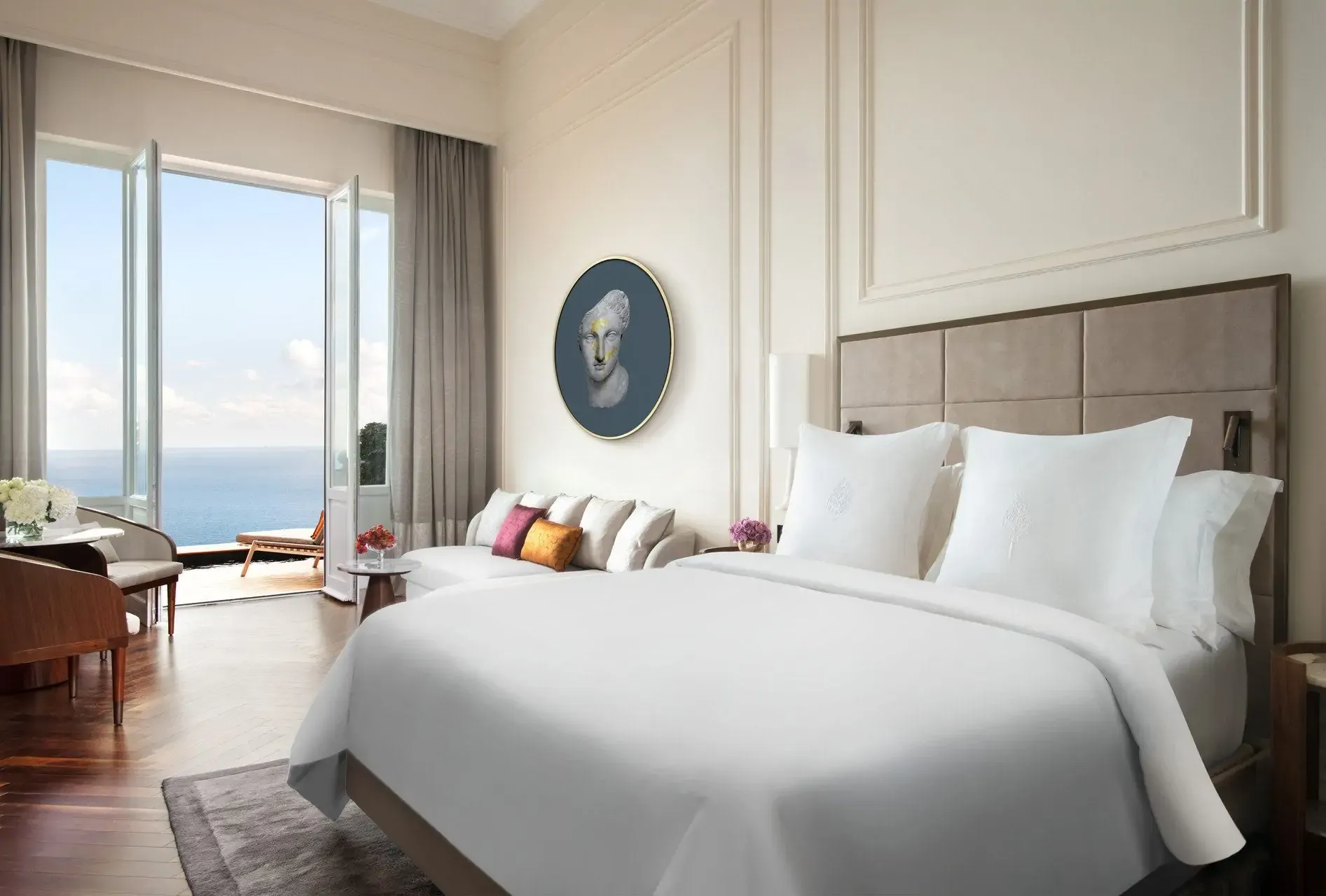 A luxury hotel room in white with balcony seaview
